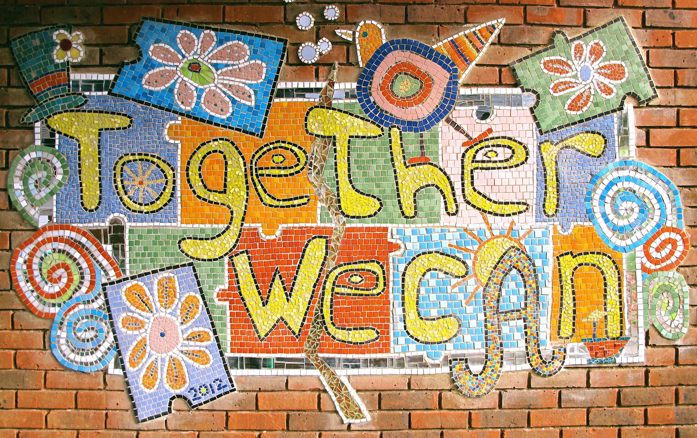 Completed work cemented directly to the wall. Winner of best School mosaic 2012 Mega Mosaics sponsored by Topps Tiles.