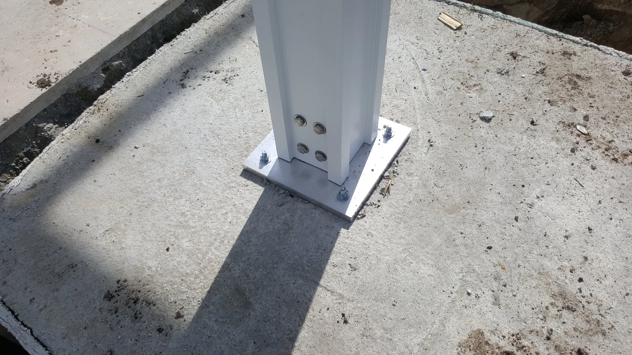 This Footer was 42 inches square for a waterfront Louvered Roof Pergola, and held almost 100 bags of concrete EACH. Footers this size cost $800 each.
