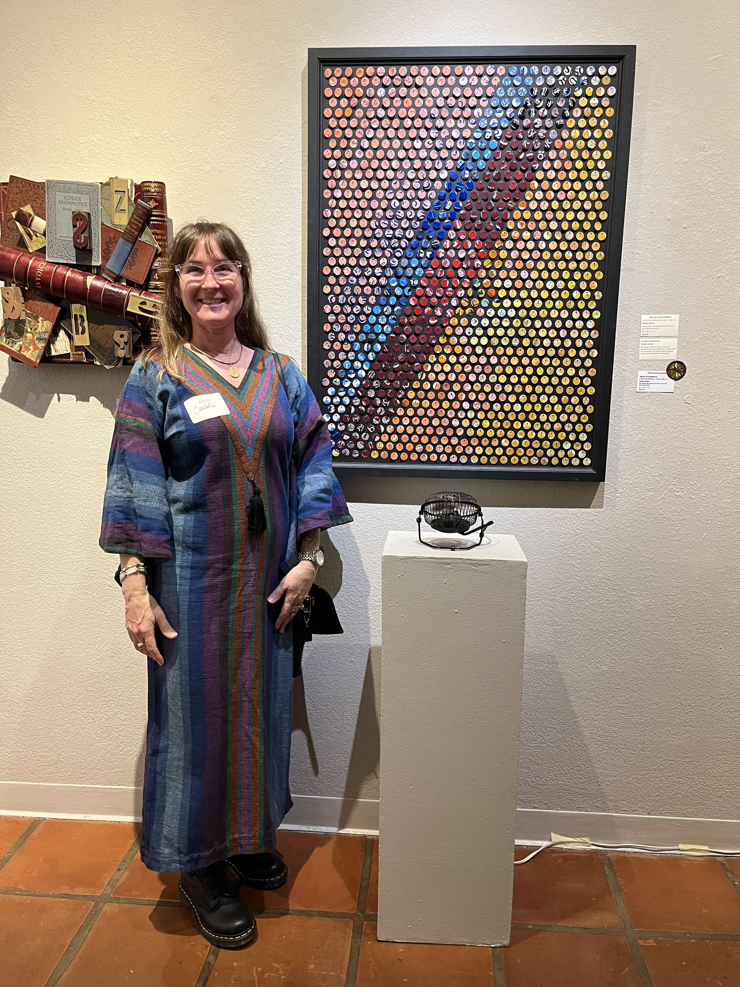  Carlotta Brandenburg with her piece entitled “Kinetic Breeze,” winner of Award of Excellence. 