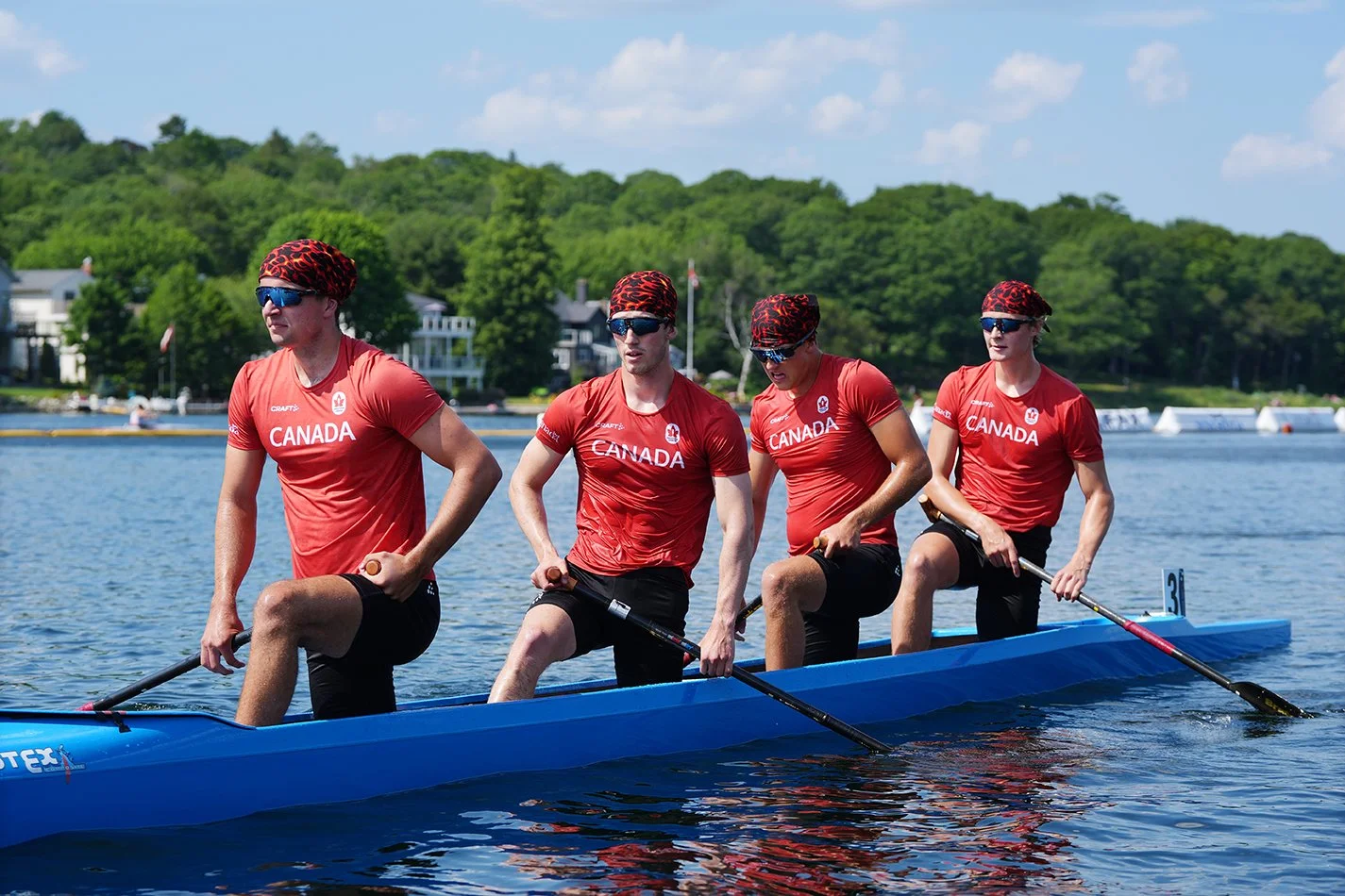 Duncan in a race canoe with his team of three others