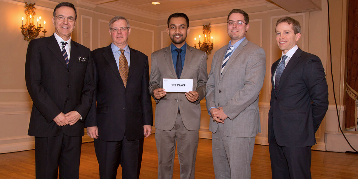 Far left: George Athanassakos, Professor of Finance & Director of Ben Graham Centre for Value Investing @ Ivey Business School, Western University Middle: The Winners Bill MacGregor, Dev Jyoty Nath, Morris MacLeod Far right: Doug Winslow of Burgundy Asset Management one of the judges for the event. Burgundy is one of the sponsors for the event.