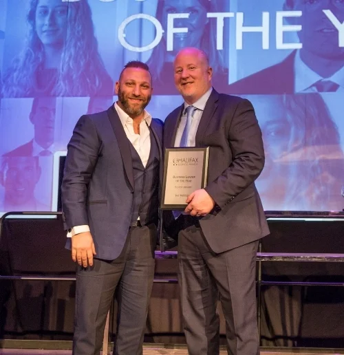 Joe Metlege (left) receives the Silver Award for Business Leader of the Year