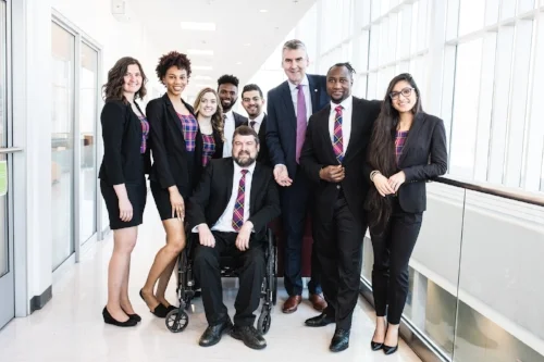 Premier Stephen McNeil on campus to congratulate Enactus team on the success of the Square Roots food token program