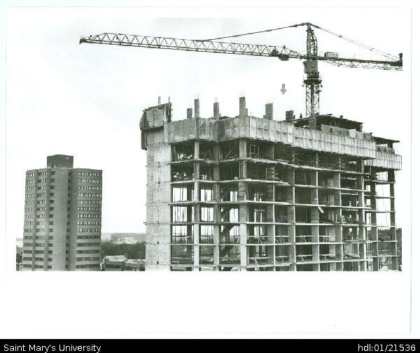  Photograph of the construction of Loyola residence, with Rice and Vanier residences in the background. 