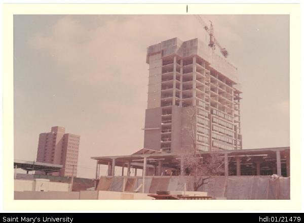  Photograph of the construction of Loyola complex in depths of winter, with Vanier residence and the Huskies Stadium in the background. 