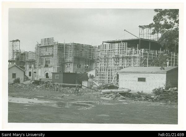  Photograph of construction of McNally Building taken from the end of Robie Street (by the present Oaks property) facing northeast. The two shacks do not appear in photos taken early in the construction, so likely they were built as construction HQ a