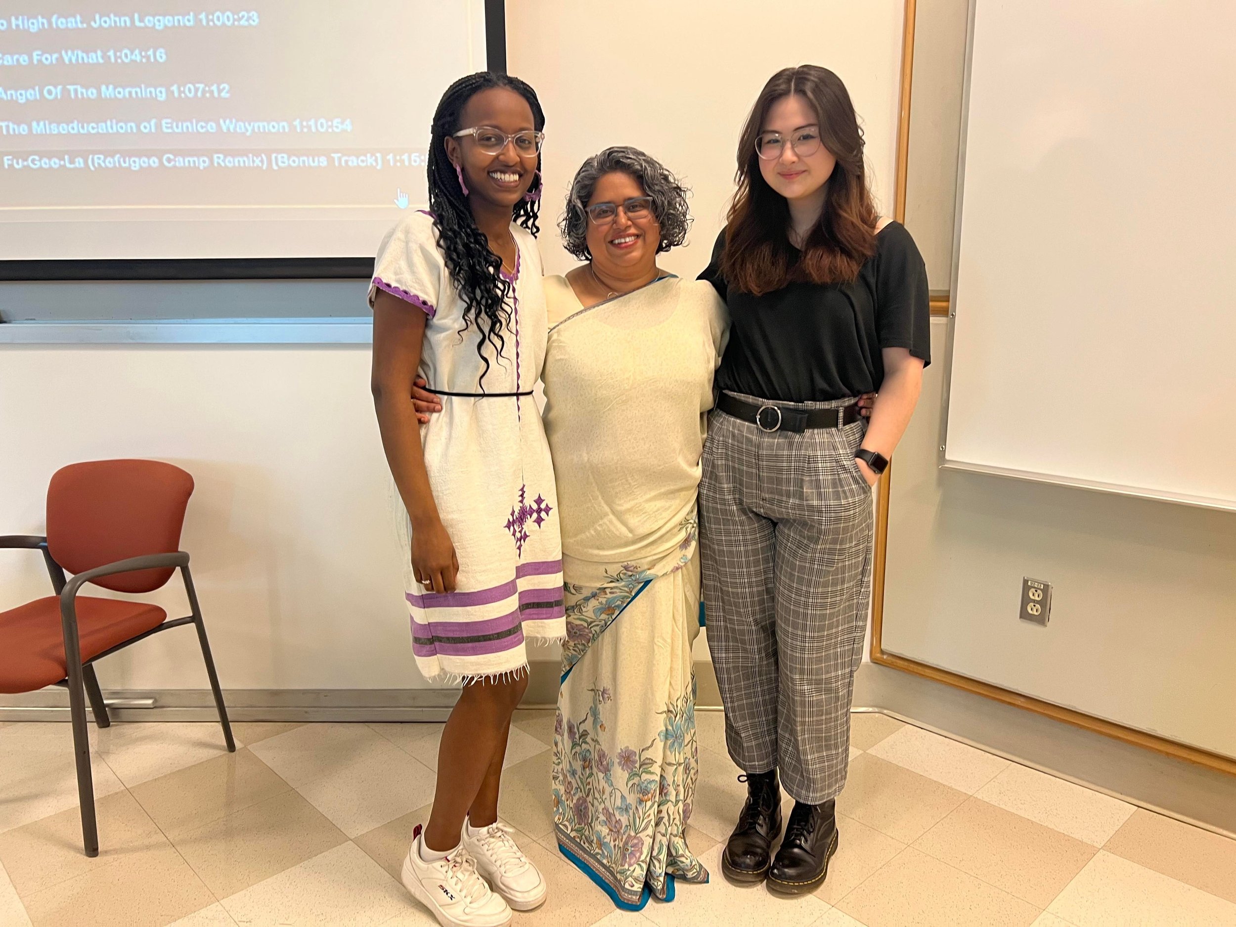  Dr. Bunjun with Fisson Tibbo (at left) and Jenn Waugh (at right), student coordinators of the 5th annual Critical Indigenous, Race and Feminist Studies Conference at Saint Mary’s. 
