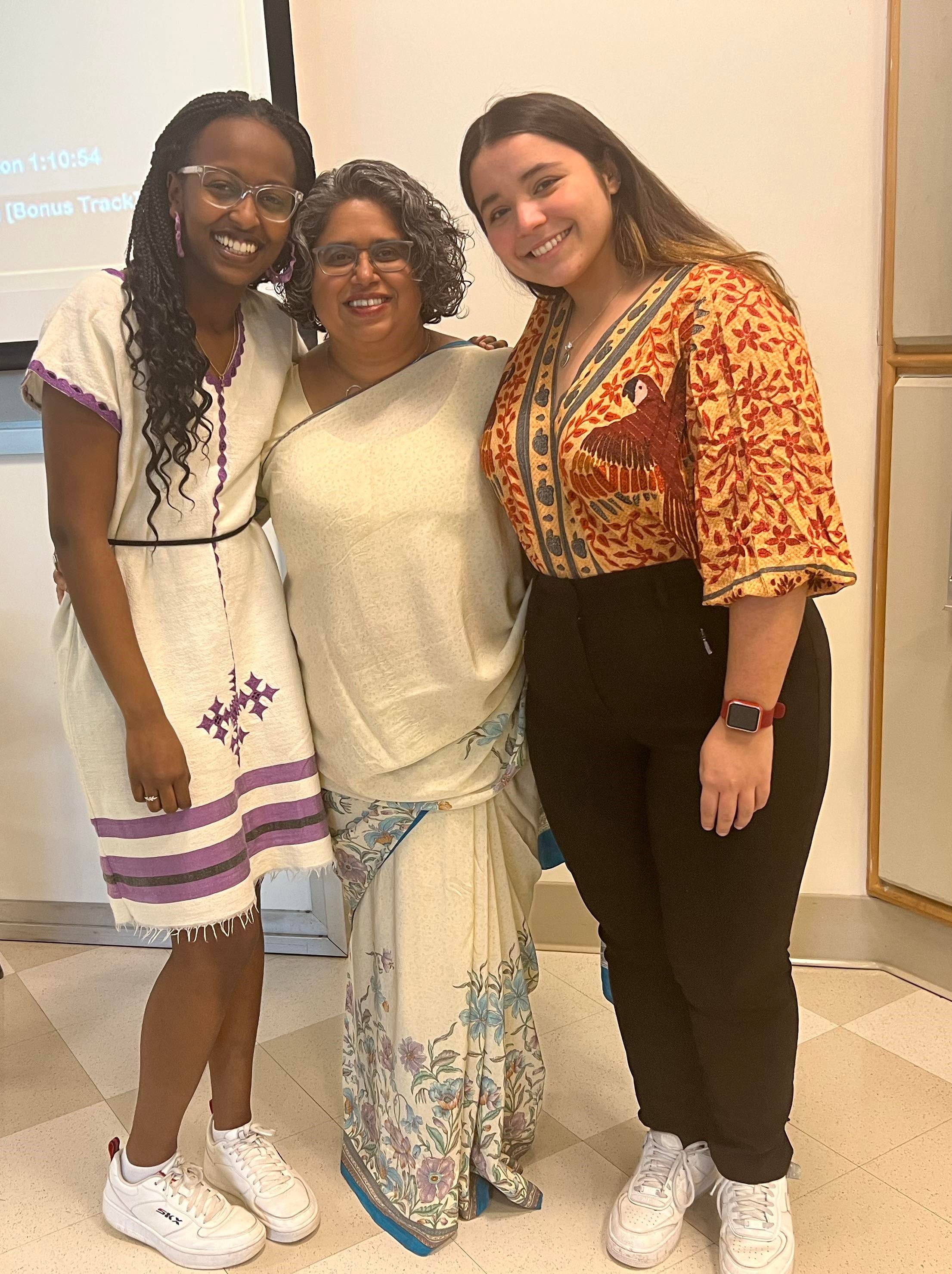  Dr. Bunjun with students Fisson Tibbo (at left) and Fernanda Matos (at right), who were emcees at the 5th annual Critical Indigenous, Race and Feminist Studies Conference at Saint Mary’s. 