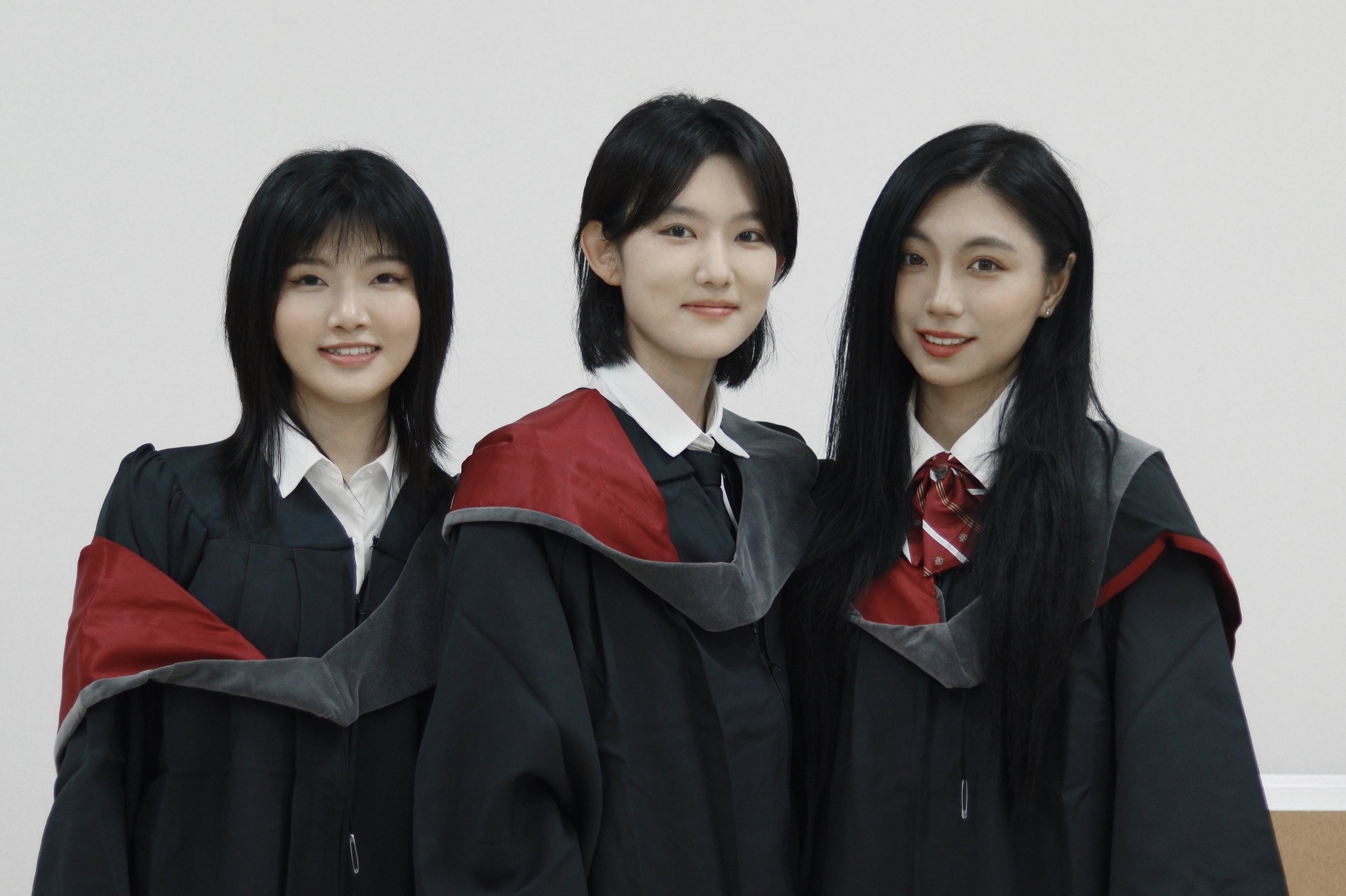  Graduates from the Joint BComm Program complete 2 degrees: a Bachelor of Commerce (major in finance) from SMU and a Bachelor of Economics from BNUZ. Yang Junying (left), Zhou Keke (centre) and Wu Xinye (right) pose for a photo wearing the Sobey BCom