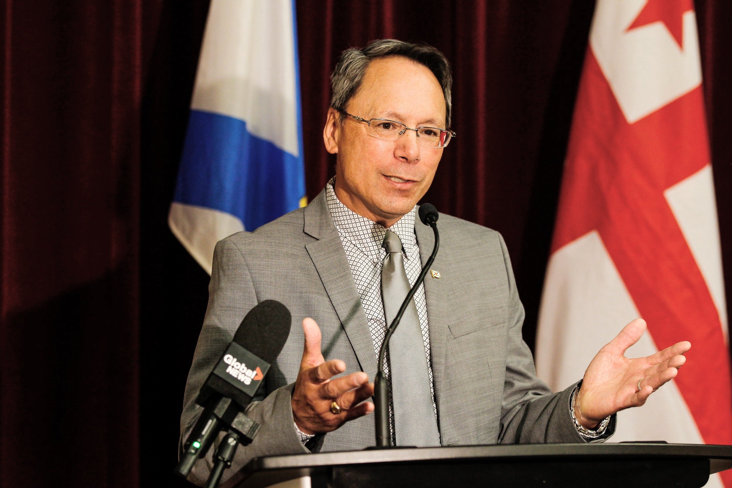  The Honourable Brian Wong, Minster of Minister of Advanced Education, at the podium. 