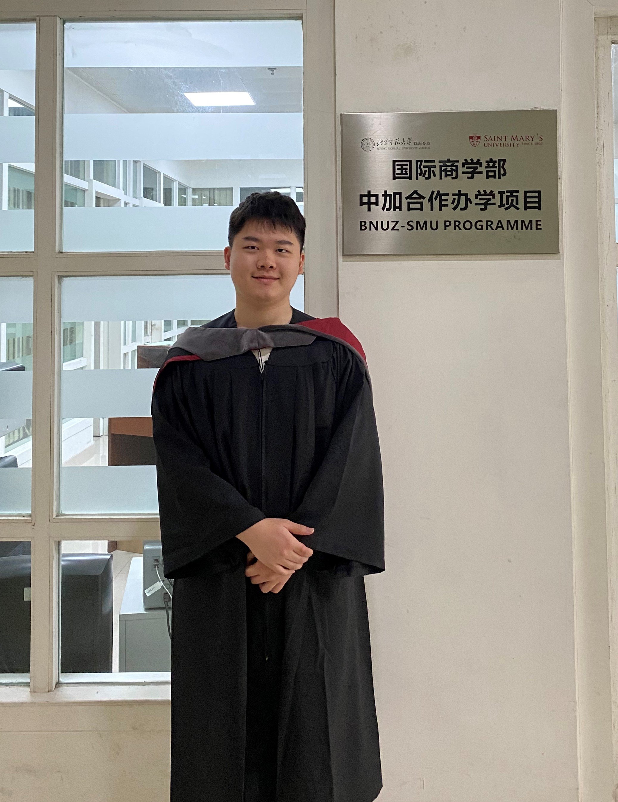  Lu Haowen stands outside of the Joint BComm program office in the BNUZ Library. He will head to Australia later this summer to begin a master’s degree at the University of Queensland. 