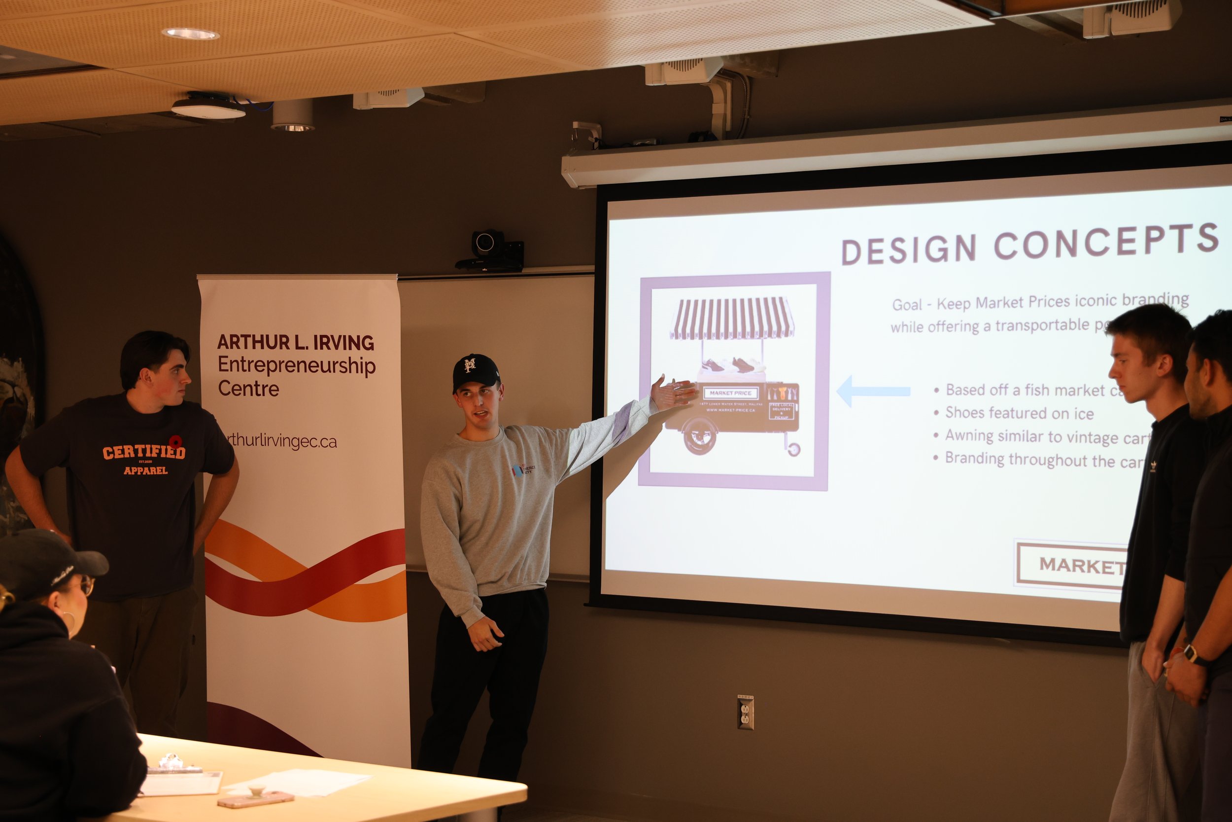 Students present a slide called Design Concepts