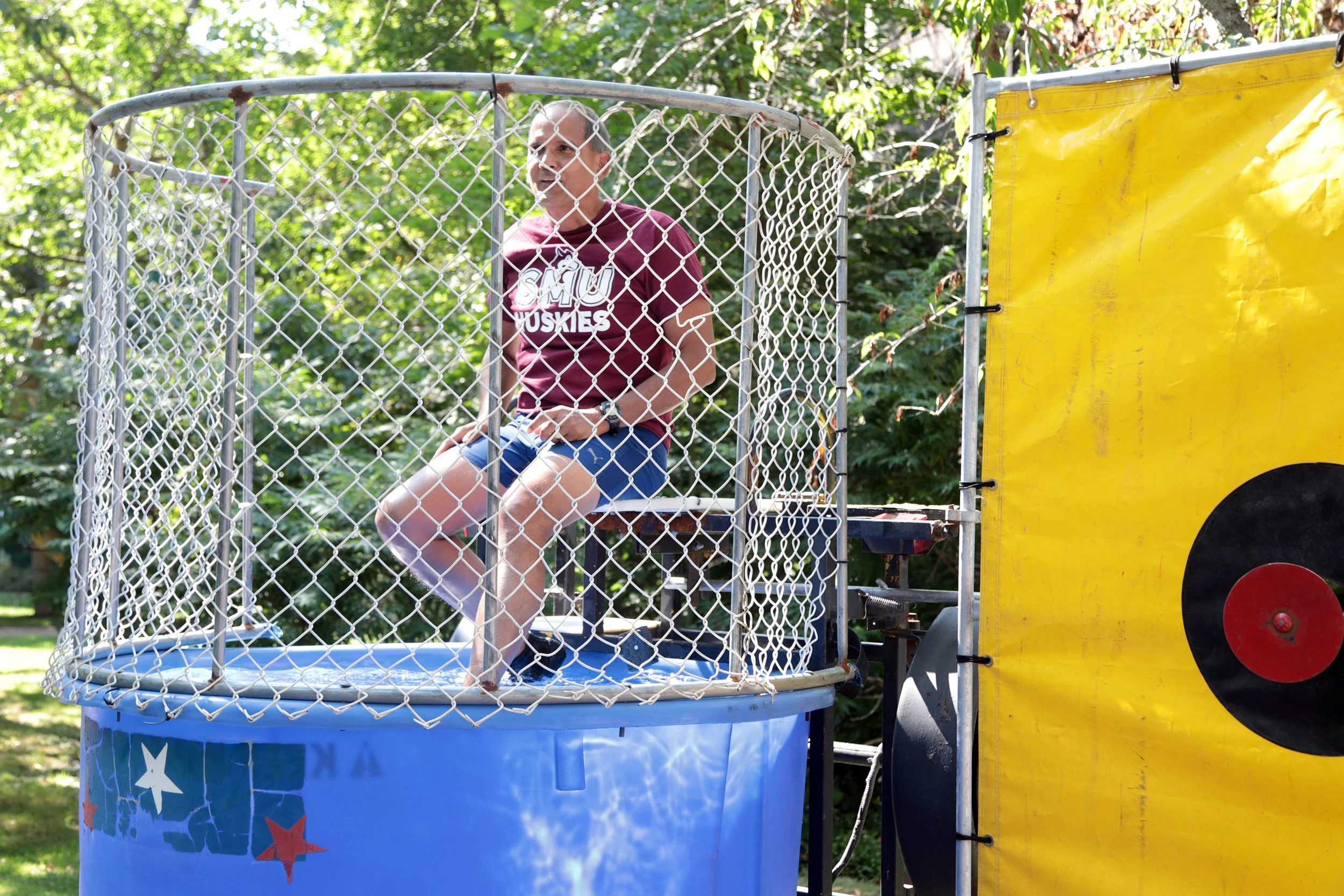  President Khan takes a dip in the dunk tank 
