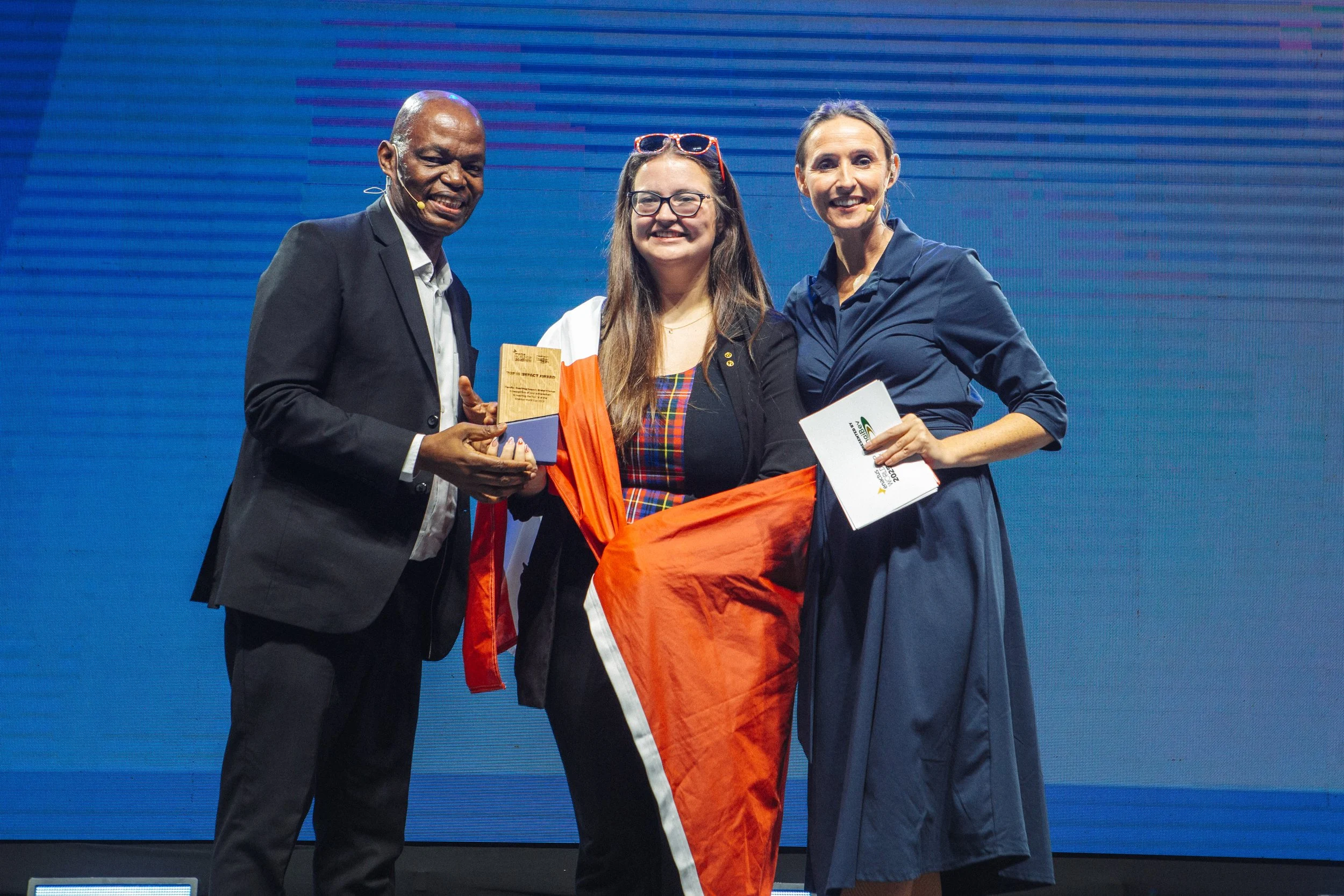 Enactus Saint Mary’s Co-President Courtney Dingle accepts an award as the team moved on to the Top 16