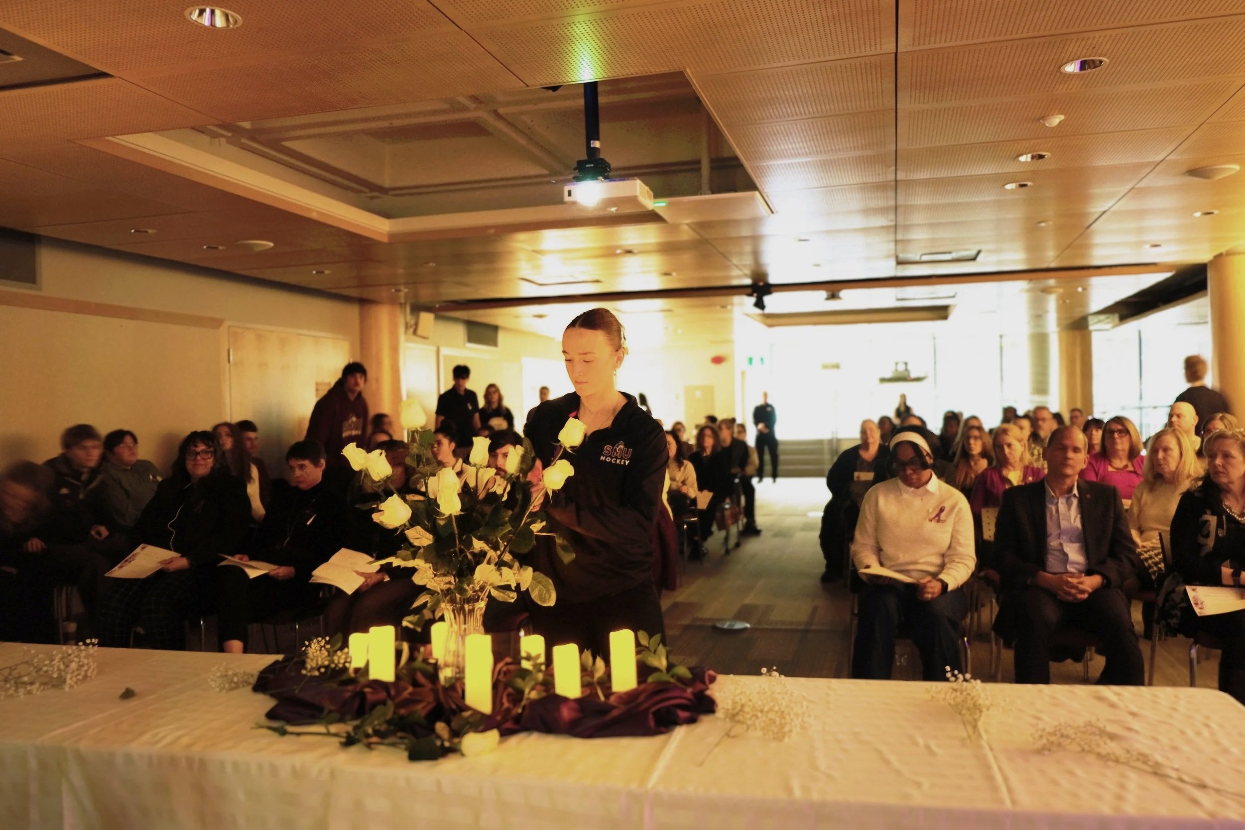  A student places a white rose to honour the victims of the 1989 École Polytechnique Montréal shooting  
