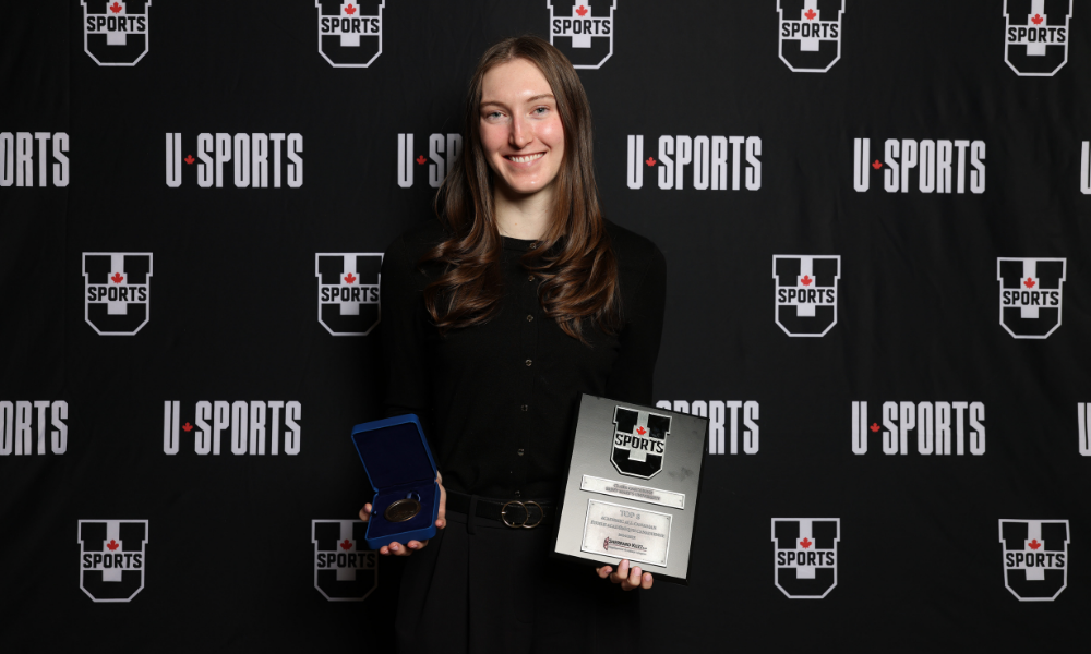  Clara Gascoigne accepts her Top 8 Academic All-Canadian award. Credit: Michael P. Hall 