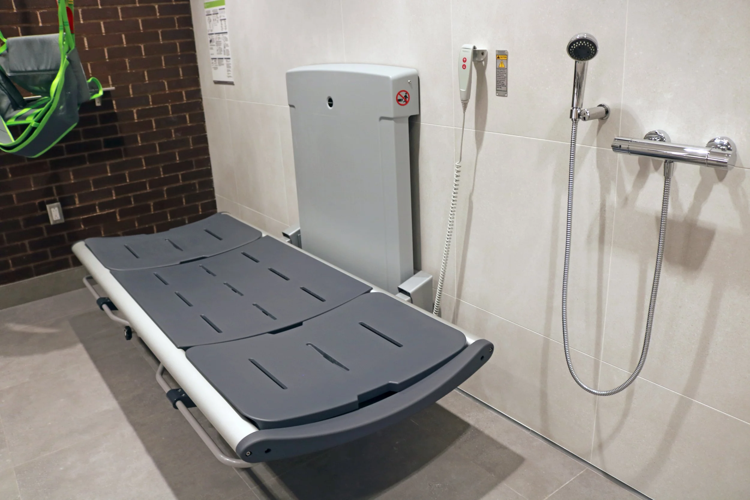  The washroom features an adult-sized change table  