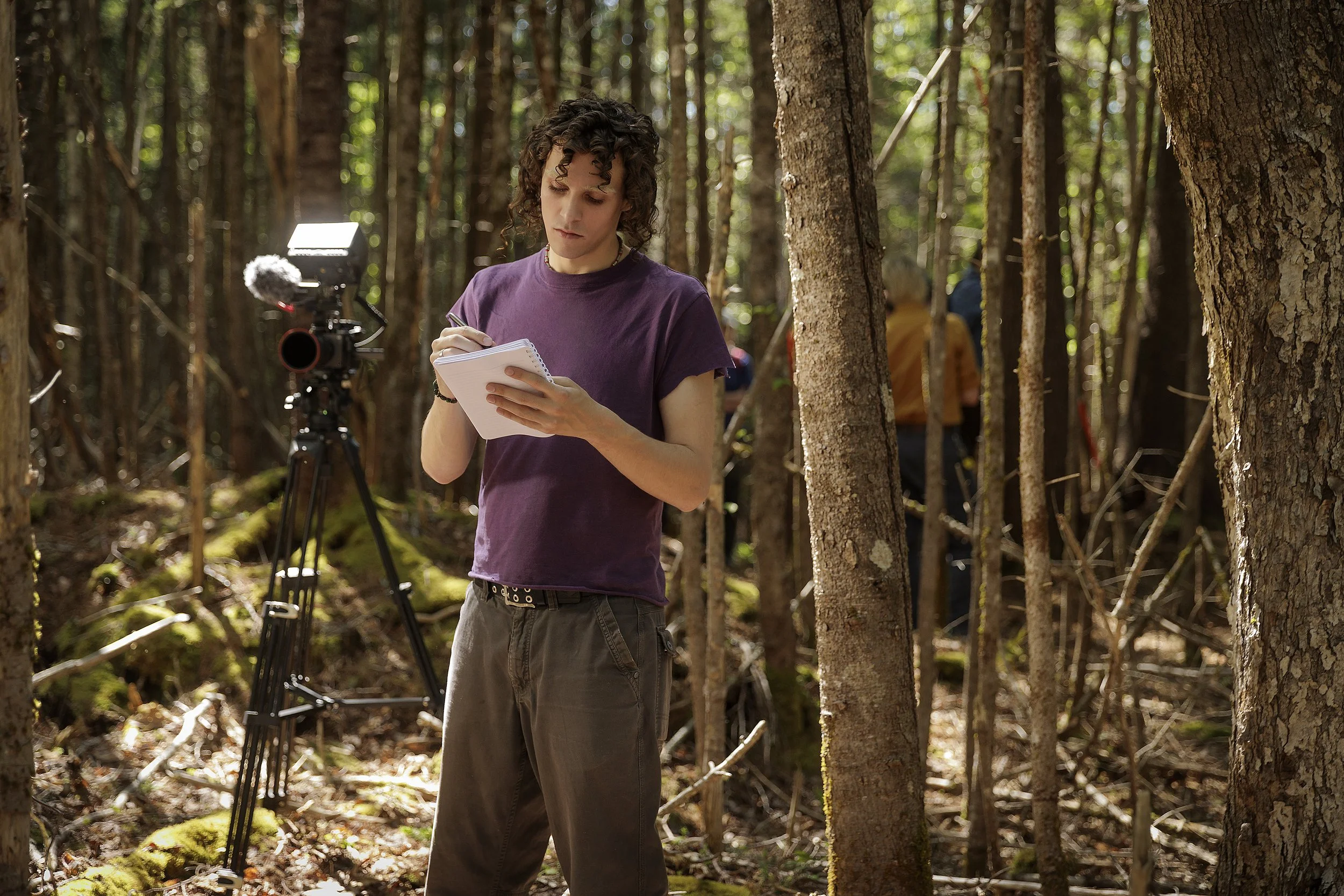 Ben in the woods with camera equipment