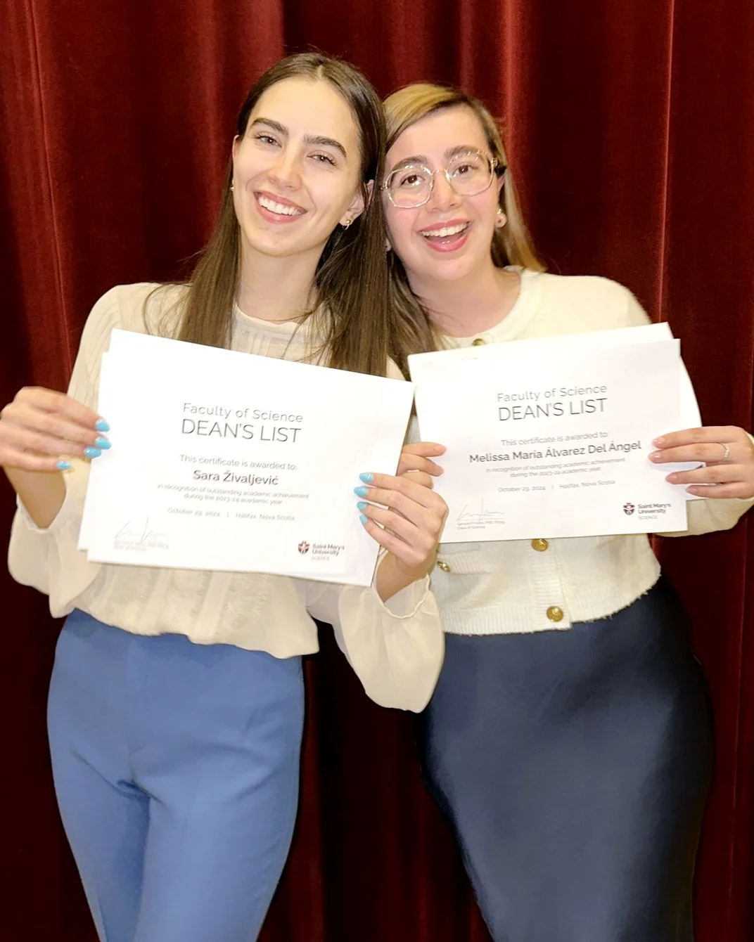 Sara and Melissa hold her Dean's List certificates