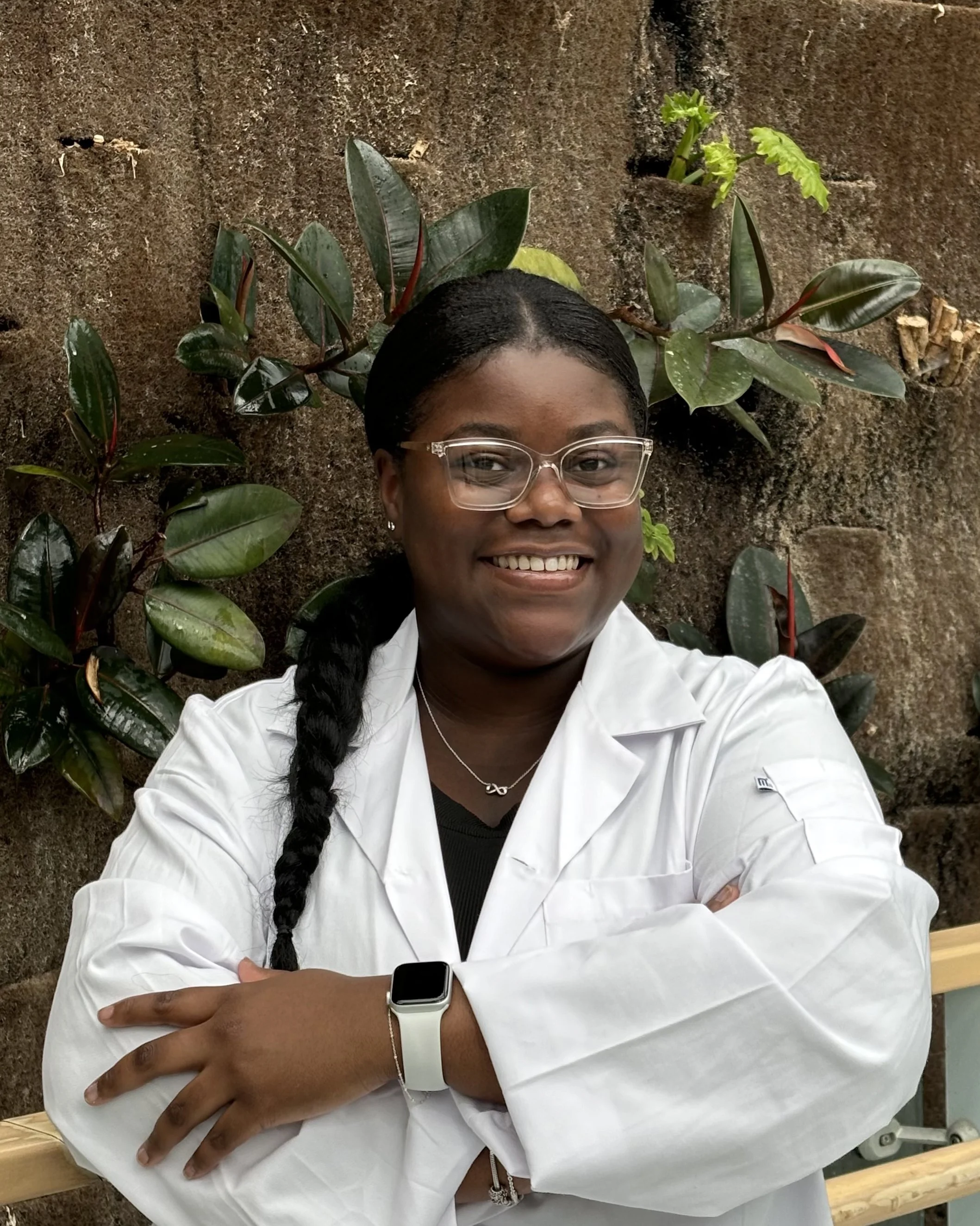 Tashauna wears a white lab coat