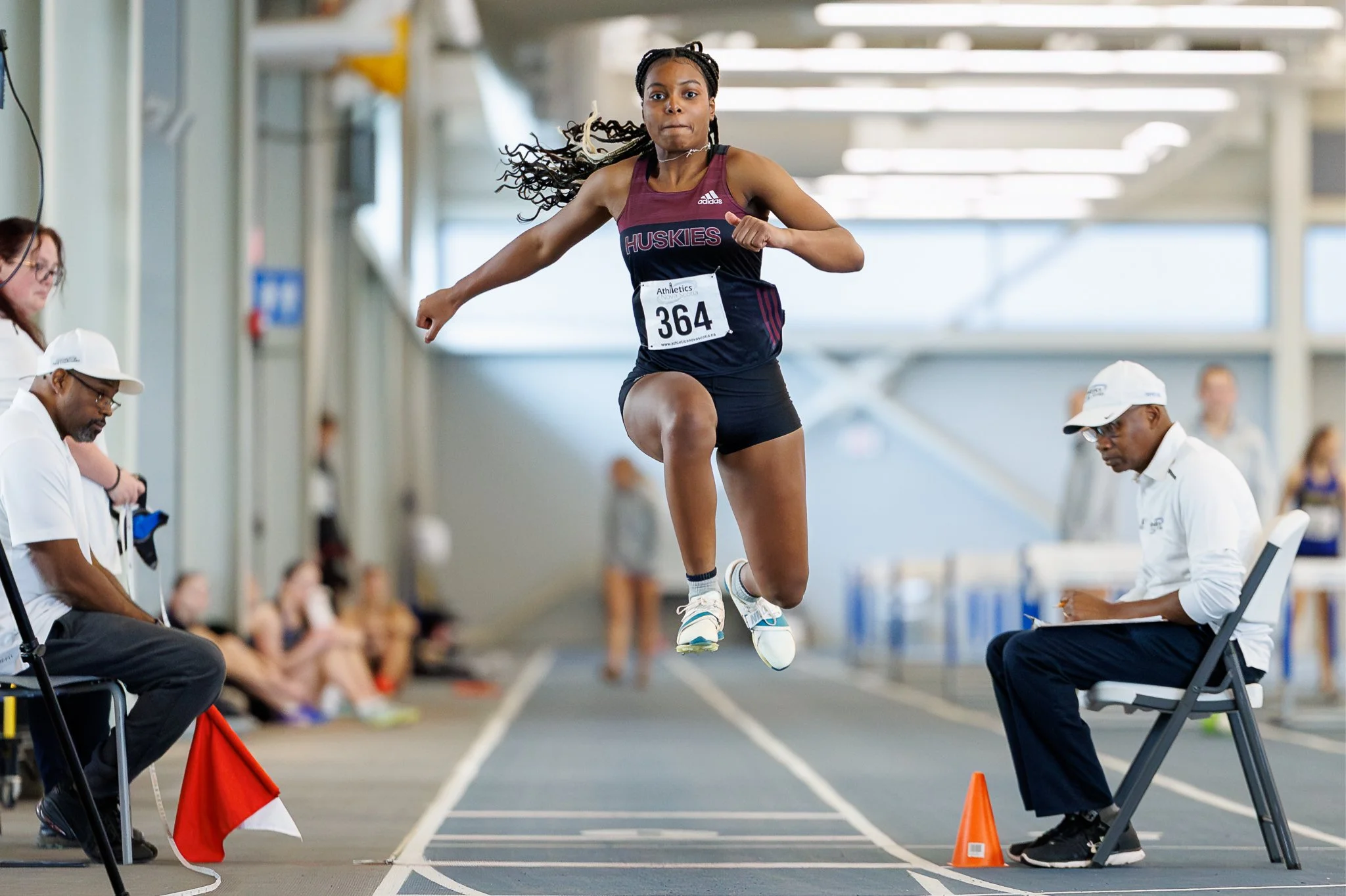 Elisha jumps on an athletic track