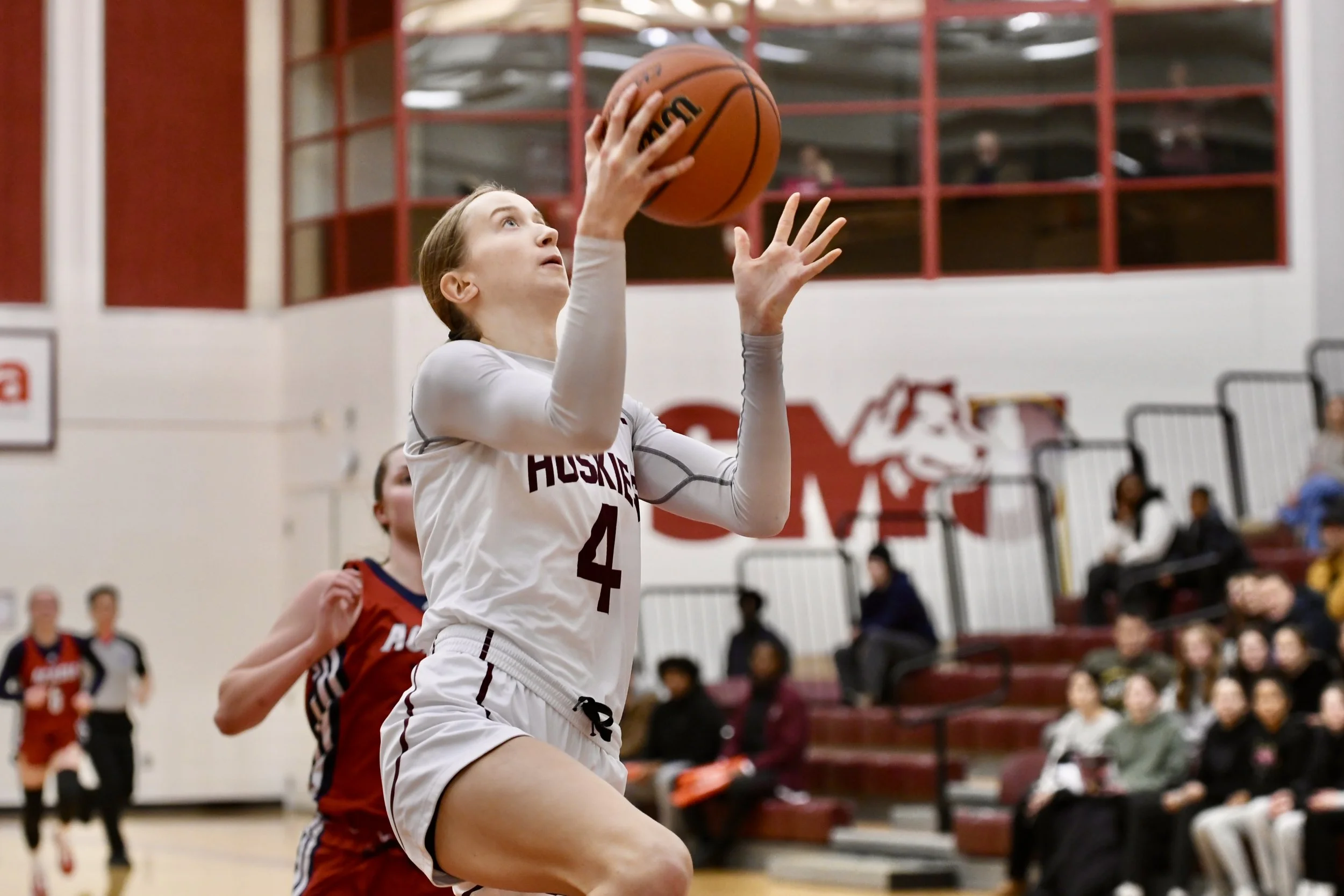 Katelyn shoots a basketball during a game