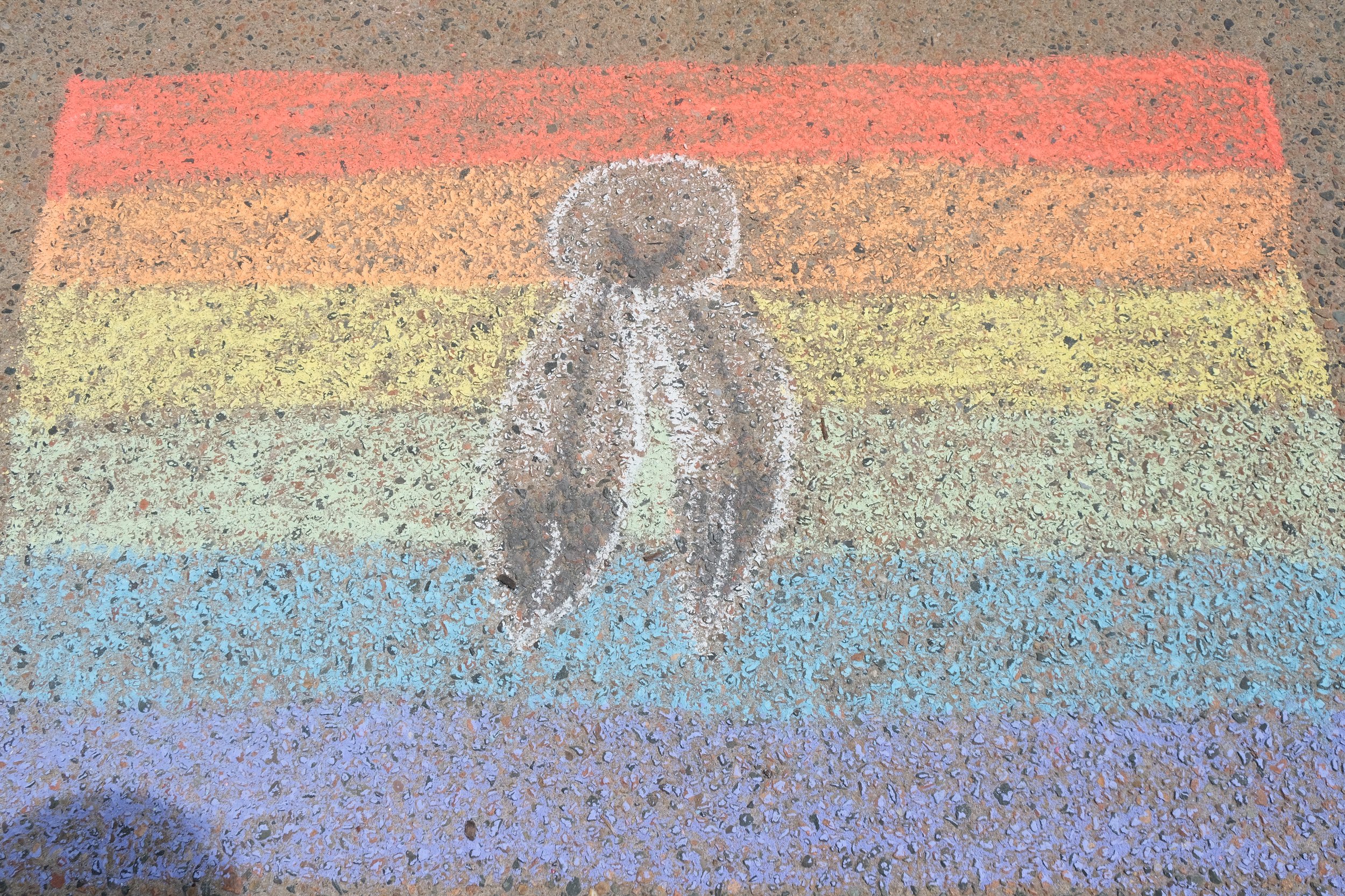A chalk drawing of the two spirit flag