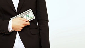 Shutterstock photo of a man holding money .