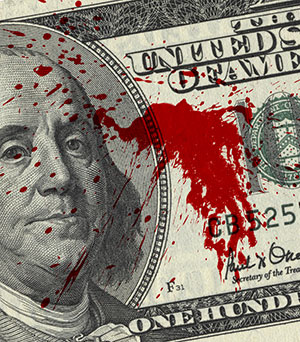 Shutterstock photo of a bill fragment with blood spots .