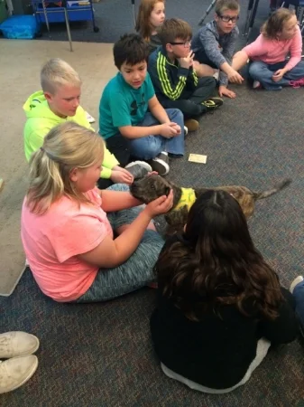 Angel visits with some children at Anderson Elementary school. This classroom raised more than $200 for her care!