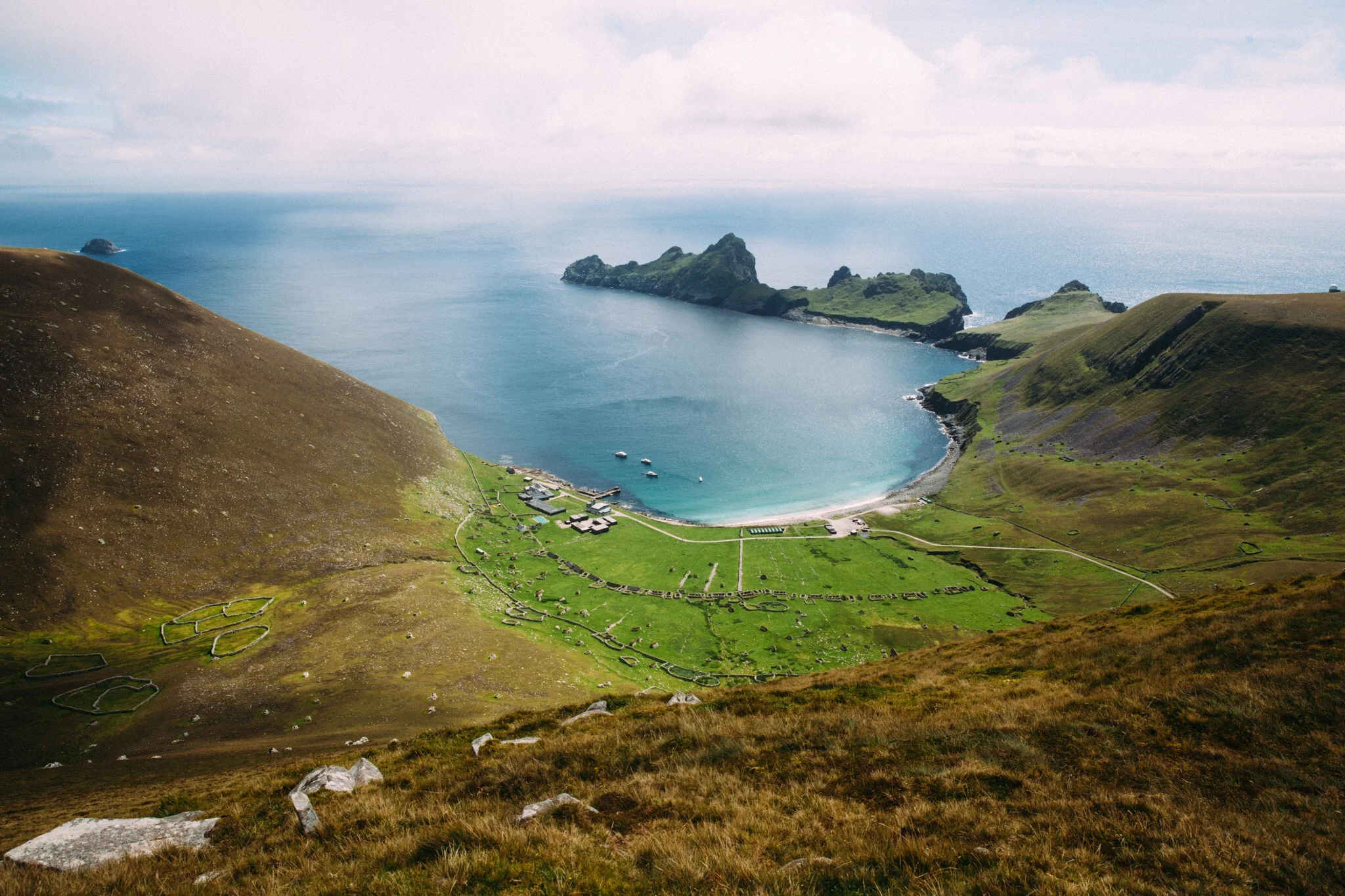 Village Bay on Hirta, the only inhabited island of the St Kilda Archipelago. Dun, the island at centre top, was previously connected to Hirta by a rock archway which has been lost to the Atlantic. Dun comes from the Gaelic for 'shield' as it protected the bay from th Atlantic winds.