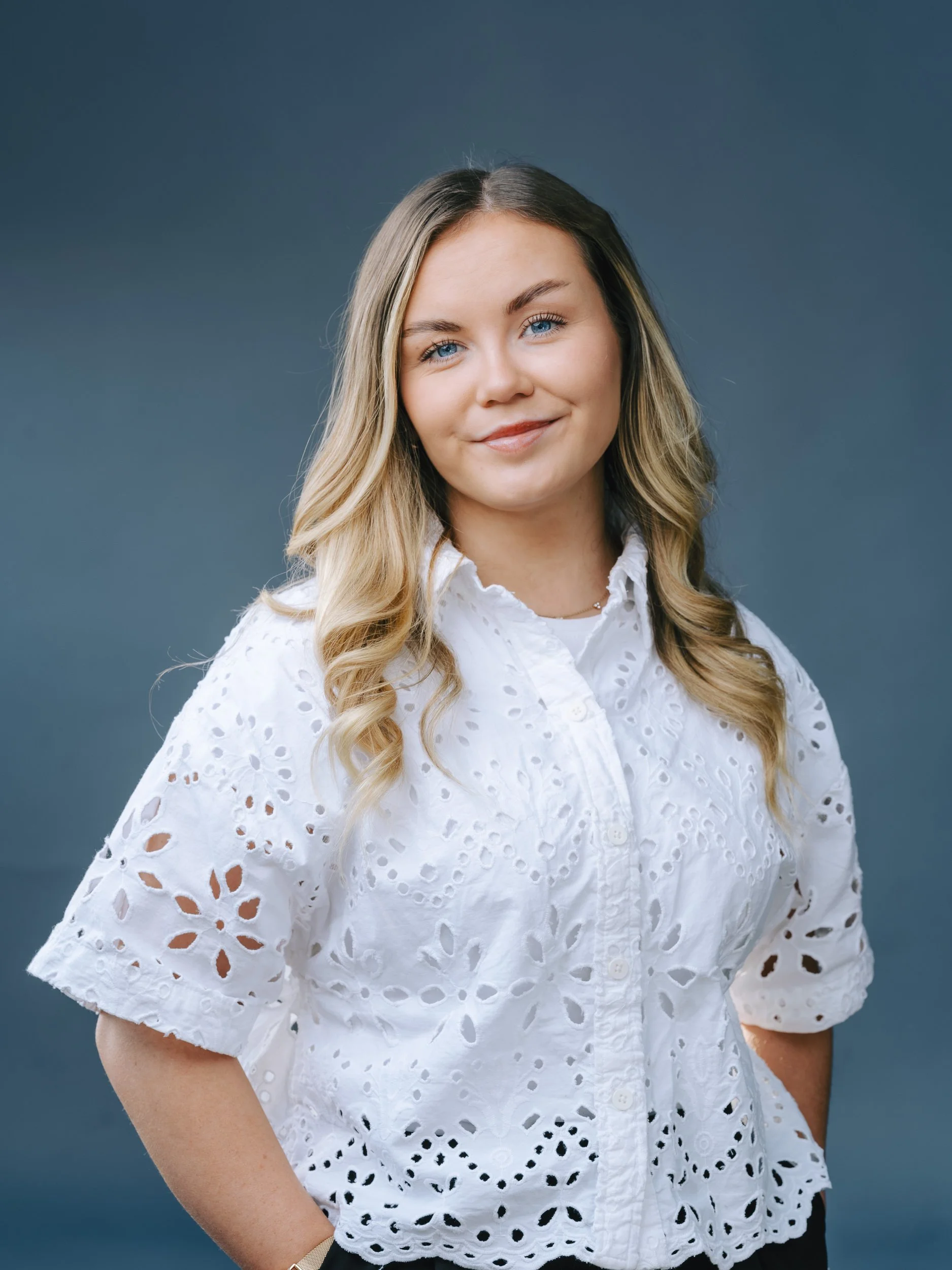 Studio business headshot, smartly dressed female professional photographed in in Scotland.