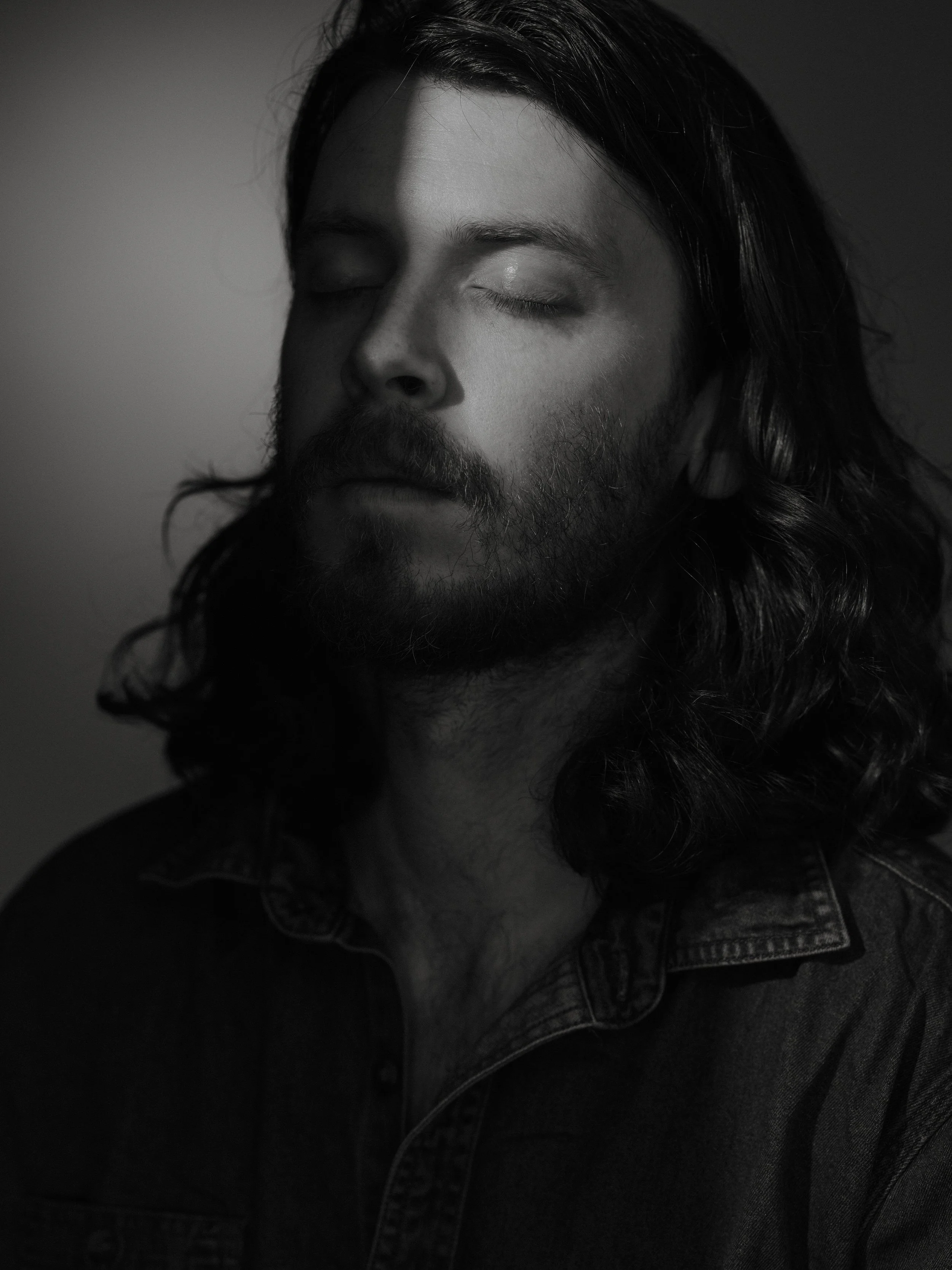 Vertical studio portrait of Old Sea Brigade intimate musician photography in Glasgow