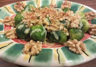 Lupe's Nutted Brussels Sprouts Find the freshest of these little cabbages you can, the smaller, the better. Remove from the stalk, slice off the ends and boil 8-10 minutes until cooked but still firm. Arrange on an oven-proof platter, sprinkle with grated cheese (Sonoma jack; gouda; gruyere -- your choice) and chopped walnuts and bake at 350 degrees until the cheese is melted and served.