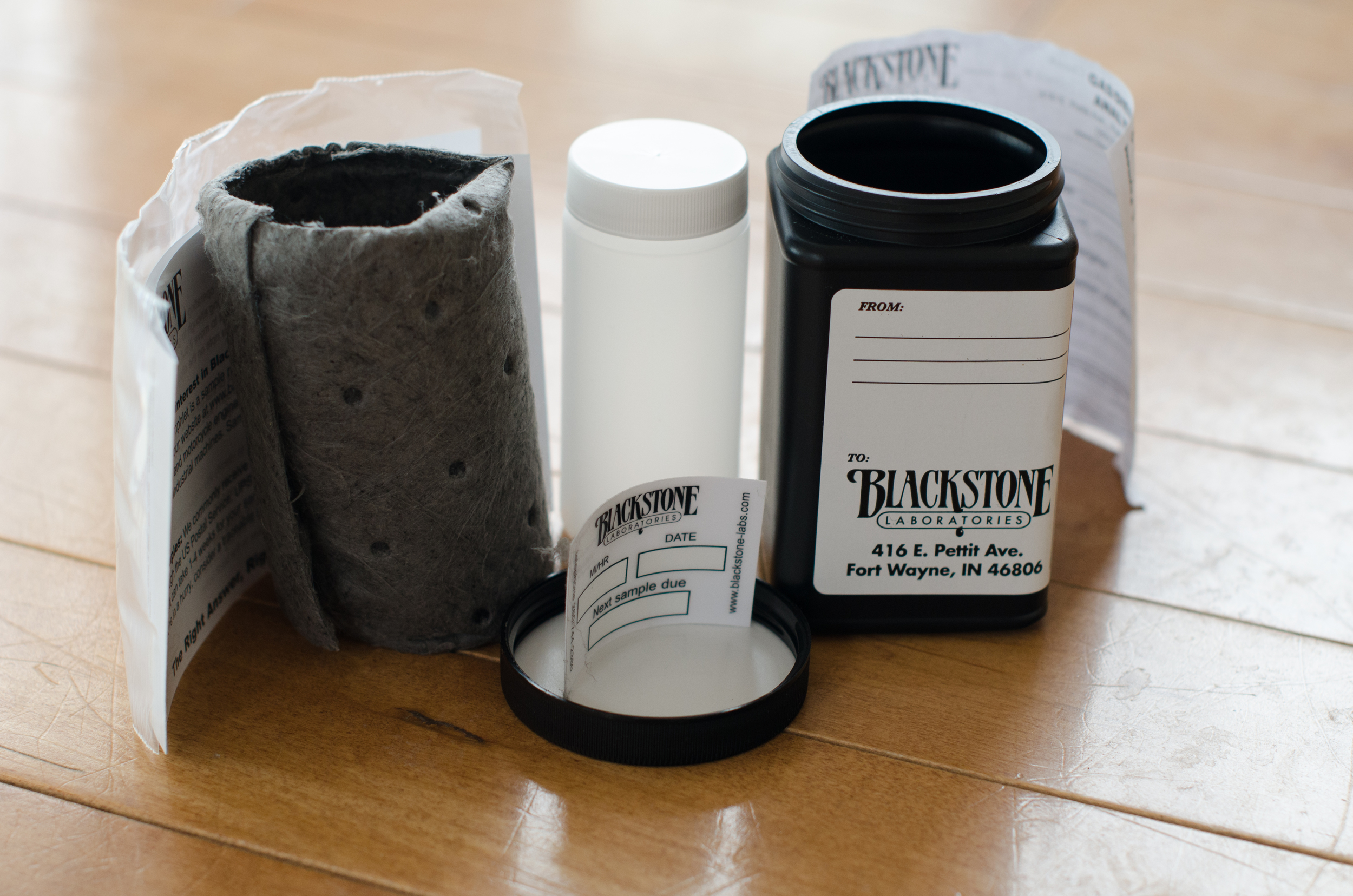 Instructions, ziploc bag, absorent material, white bottle for oil, oil reminder, and black mailer bottle