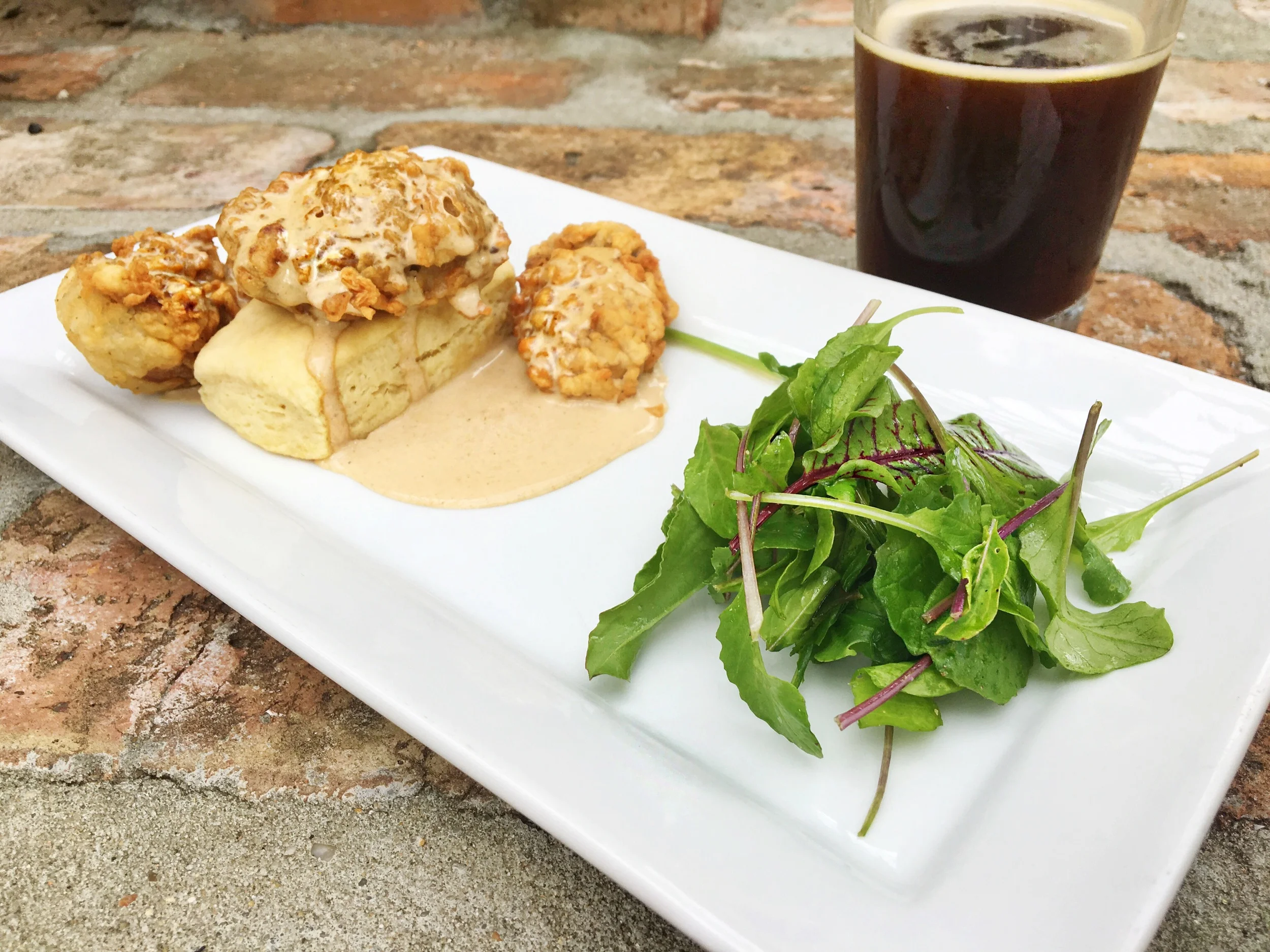 Biscuit, field greens, fried oysters, red eye gravy and Biere Joi Coffee Ale