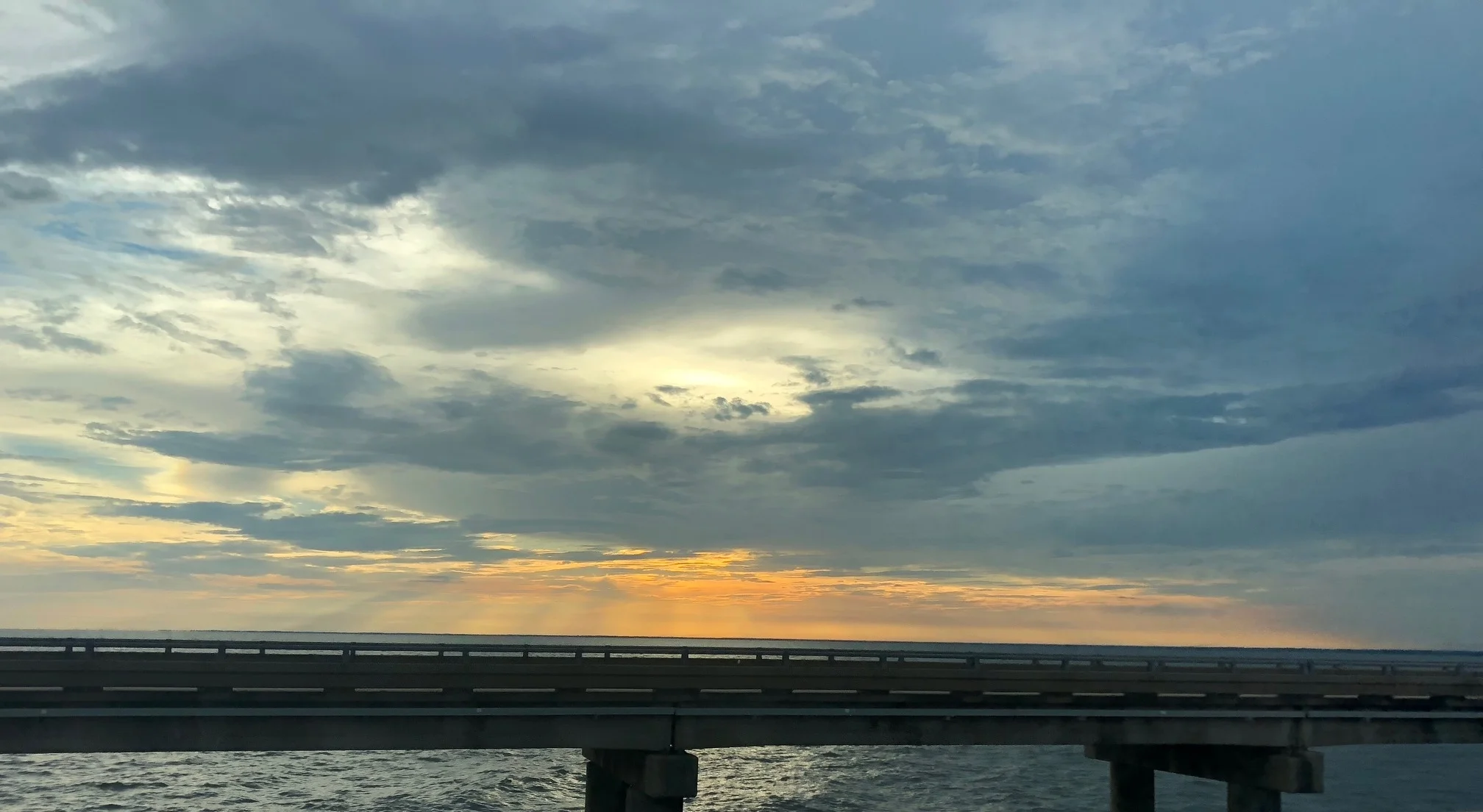 Pro tip: try not to take photos of the sunset skies while commuting on one of the longest bridges in the world. 