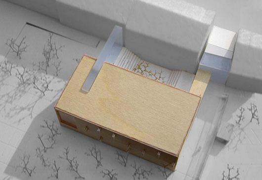 holz als werkstoff und als äusseres zeichen für das gebäude, lässt für die erstankömmlinge schneller eine vertrautheit entstehen. identifikation mit dem haus in dem man lernt steigert wahrscheinlich auch die identifikation mit dem beruf... ... ein schlichter, kubisch-kompakter baukörper, mit einer verkleidung aus grossformatigen holzplatten, wird vor das bestehende gebäude gesetzt. ein massiver, einladend-warmer, ausgehöhlter holzblock definiert den vorplatz, der zum haupteingang hinführt. dieser wird durch eine 2-geschossige glasfassade markiert, hinter der das foyer im erdgeschoss und das café im obergeschoss liegt ...