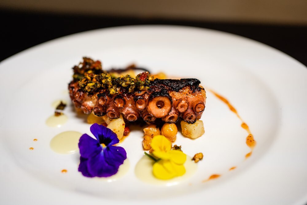  char grilled octopus over roasted chickpeas garnished with a edible flowers, dry fruit salsa, Trattoria Moma, modern Italian cuisine, philadelphia 