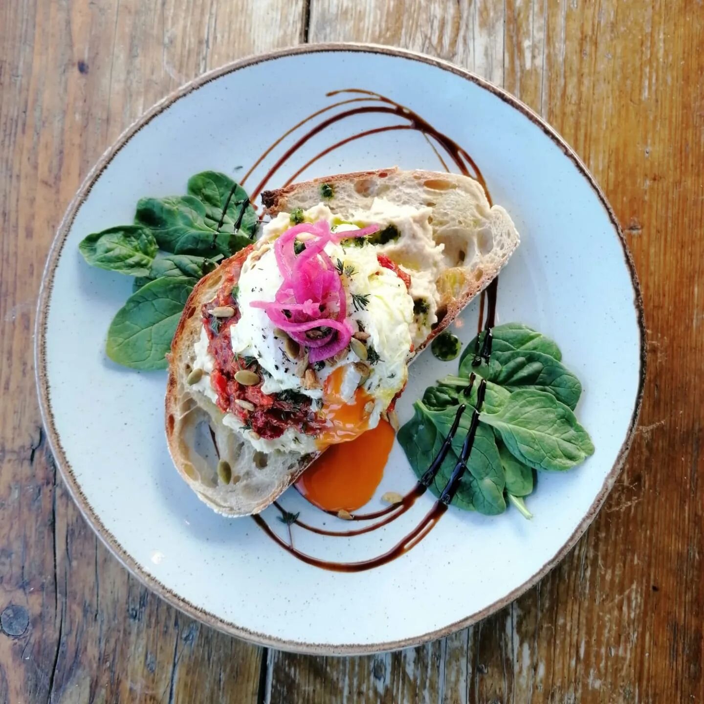 Feast for Peace Special Breakfast

Here's our Muhammara and Butterbean mash breakfast special. A layer of creamy Butterbean mash, Muhammara (spiced and smoky red pepper  and walnut sauce), a mumbled egg, served with thyme and garlic oil, toasted seed