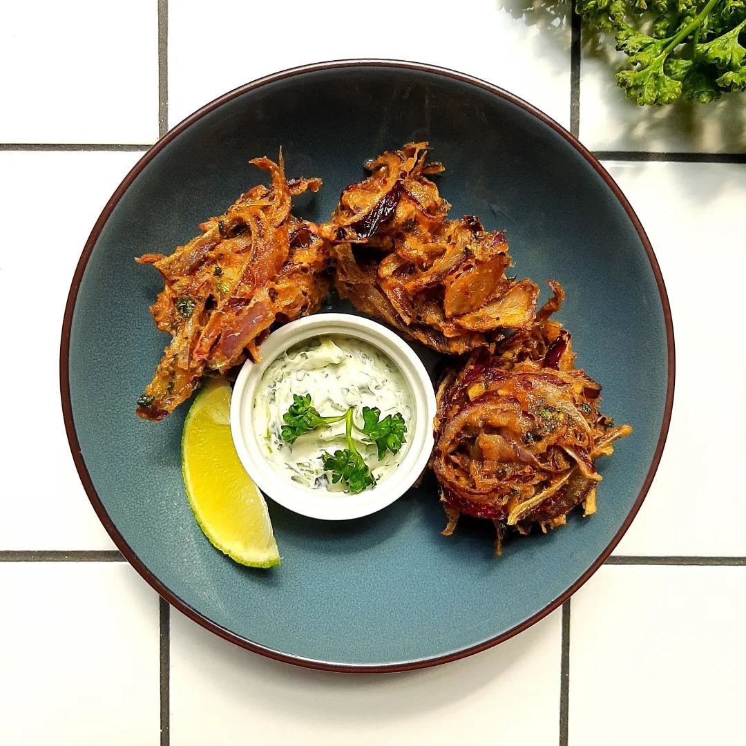 New special! Crispy onion bahjis served with cucumber and mint raita - all made fresh in house. Vegan 🌱