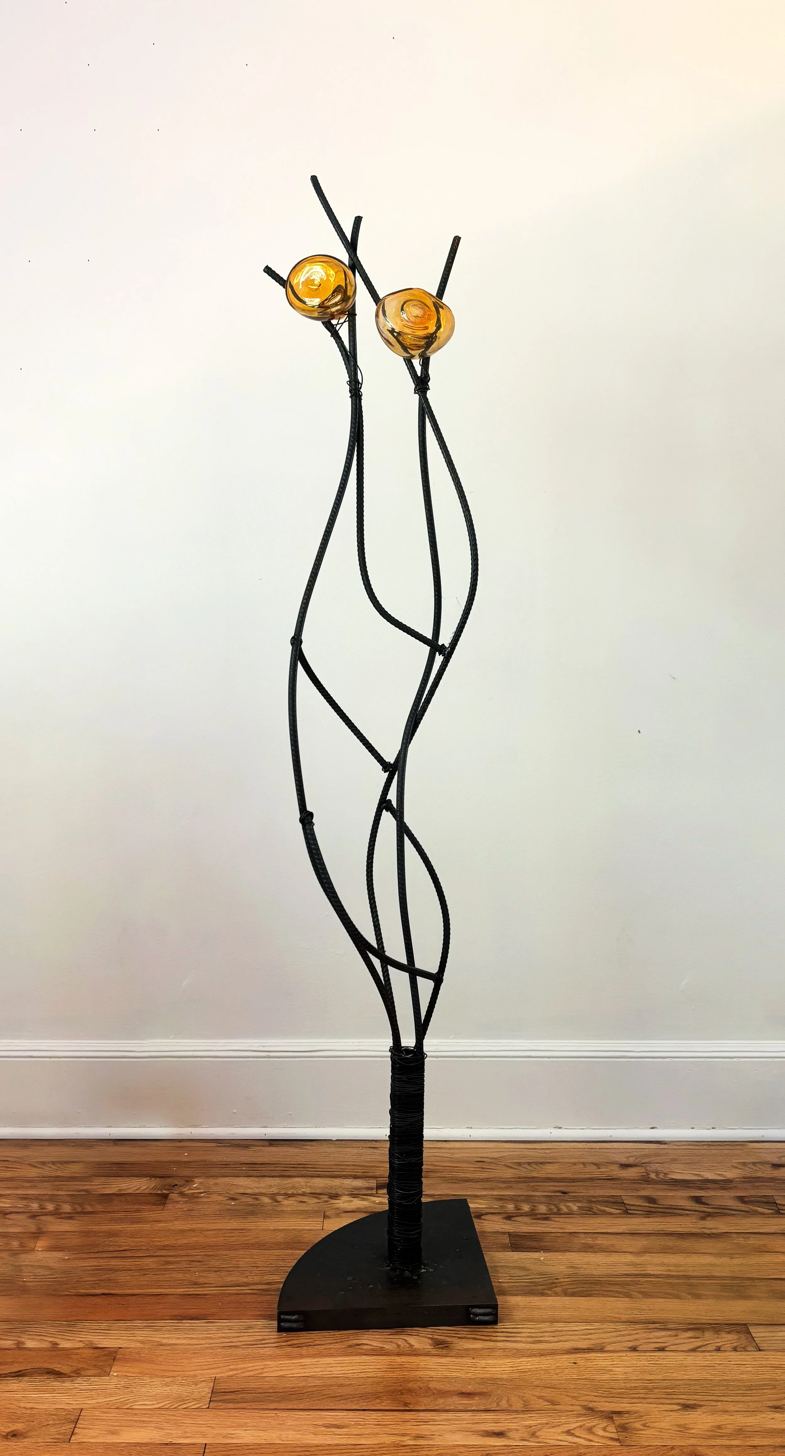 Consider a different view
Hand-blown glass, rebar, rebar ties, welded steel
2026

The Appalachian region is often flattened into various stereotypes. Many see it as a region that is uneducated, resistant to change, homogenously white, and Republican.