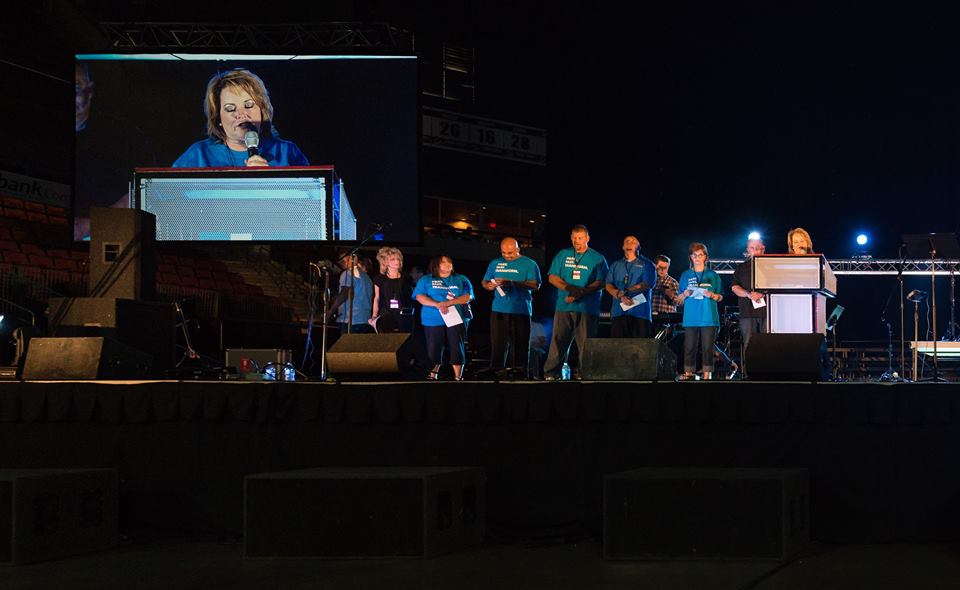 Rapid prayer volunteers ready to pray after a speaker.