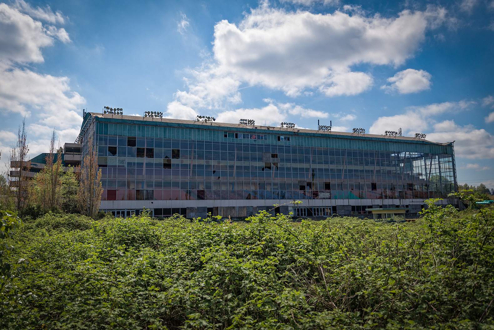 The once proud building mere weeks before demolition. Infield overgrown with berry vines.