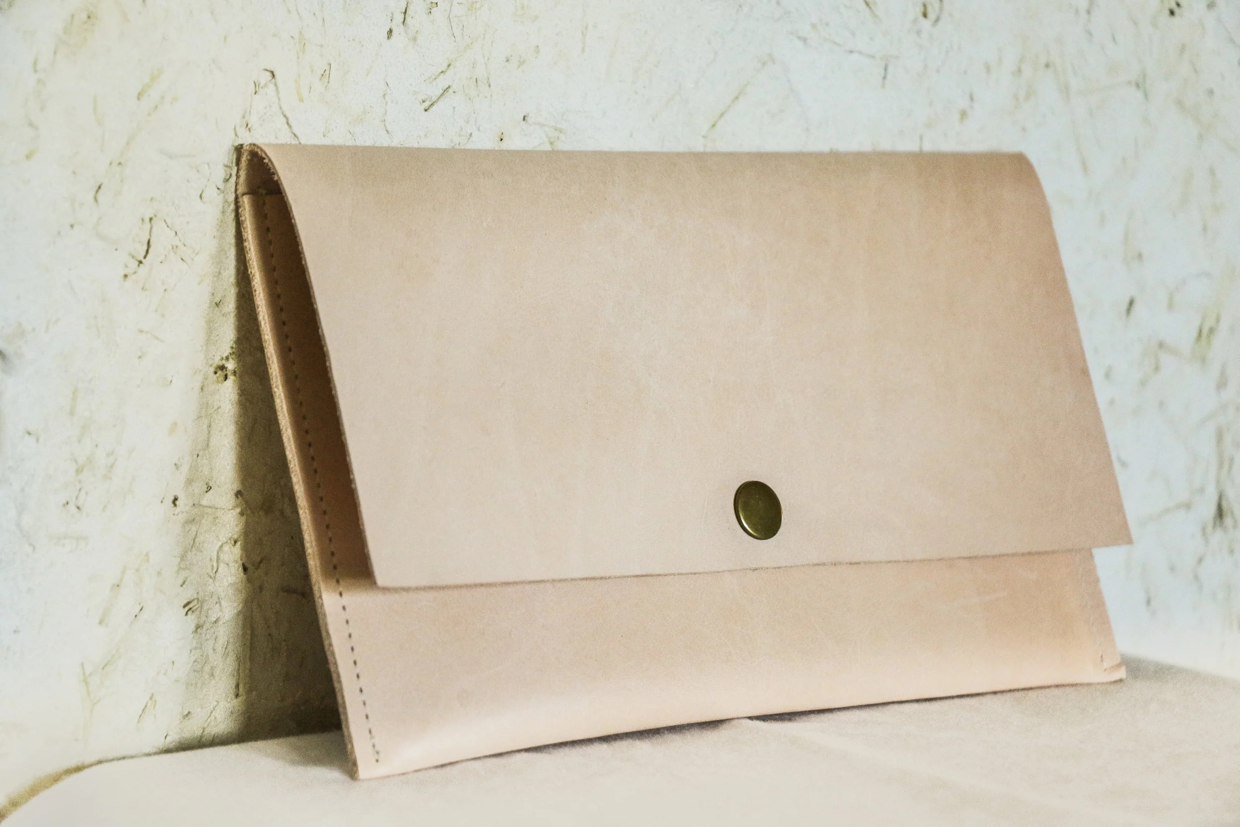 Natural leather clutch by Linny Kenney