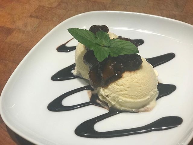 Home spun vanilla bean Icecream topped with our chipotle fig chutney from our wonderful fig tree and our fresh organic mint. Served on top of a chocolate syrup. Thanks to liz my beautiful wife for harvesting the figs and growing the mint!