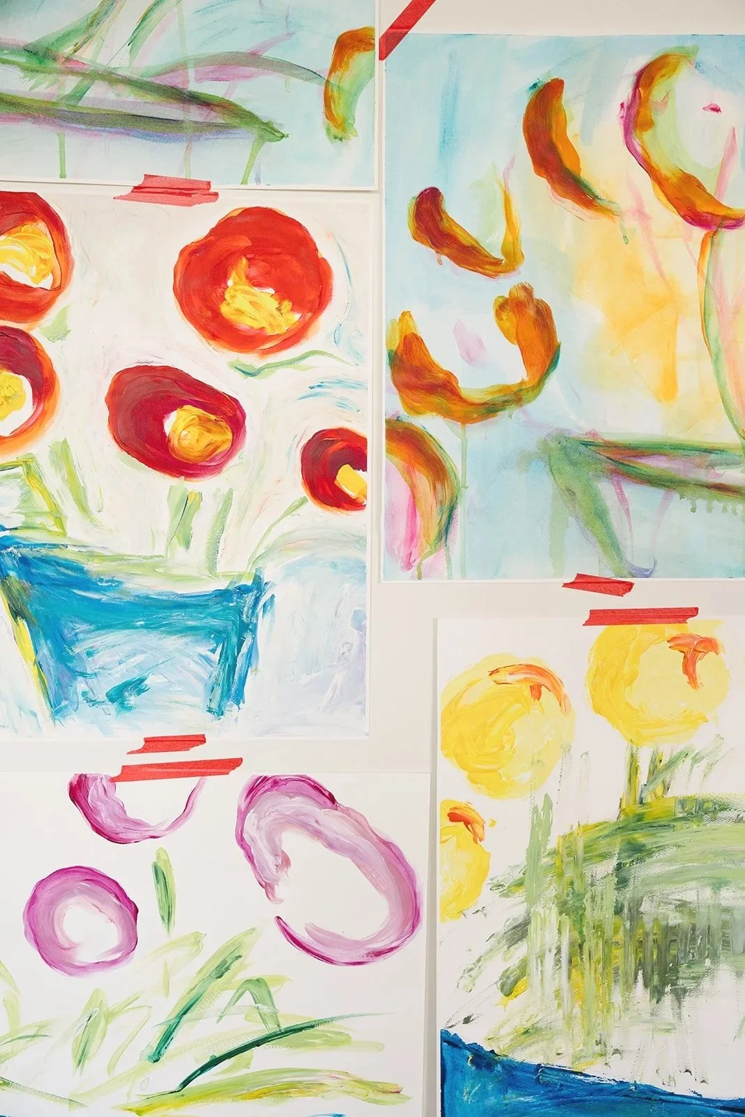 Collection of colorful floral watercolor paintings on paper, depicting various flowers and plants with bright colors and loose brushstrokes.