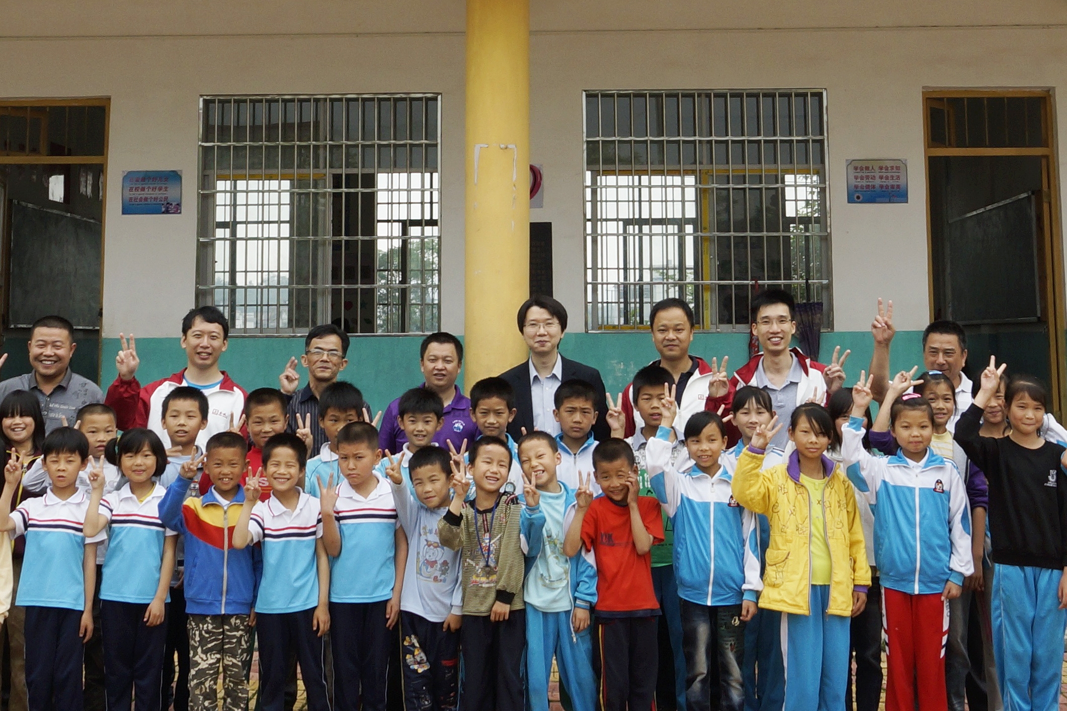 Taking pictures with teachers and students