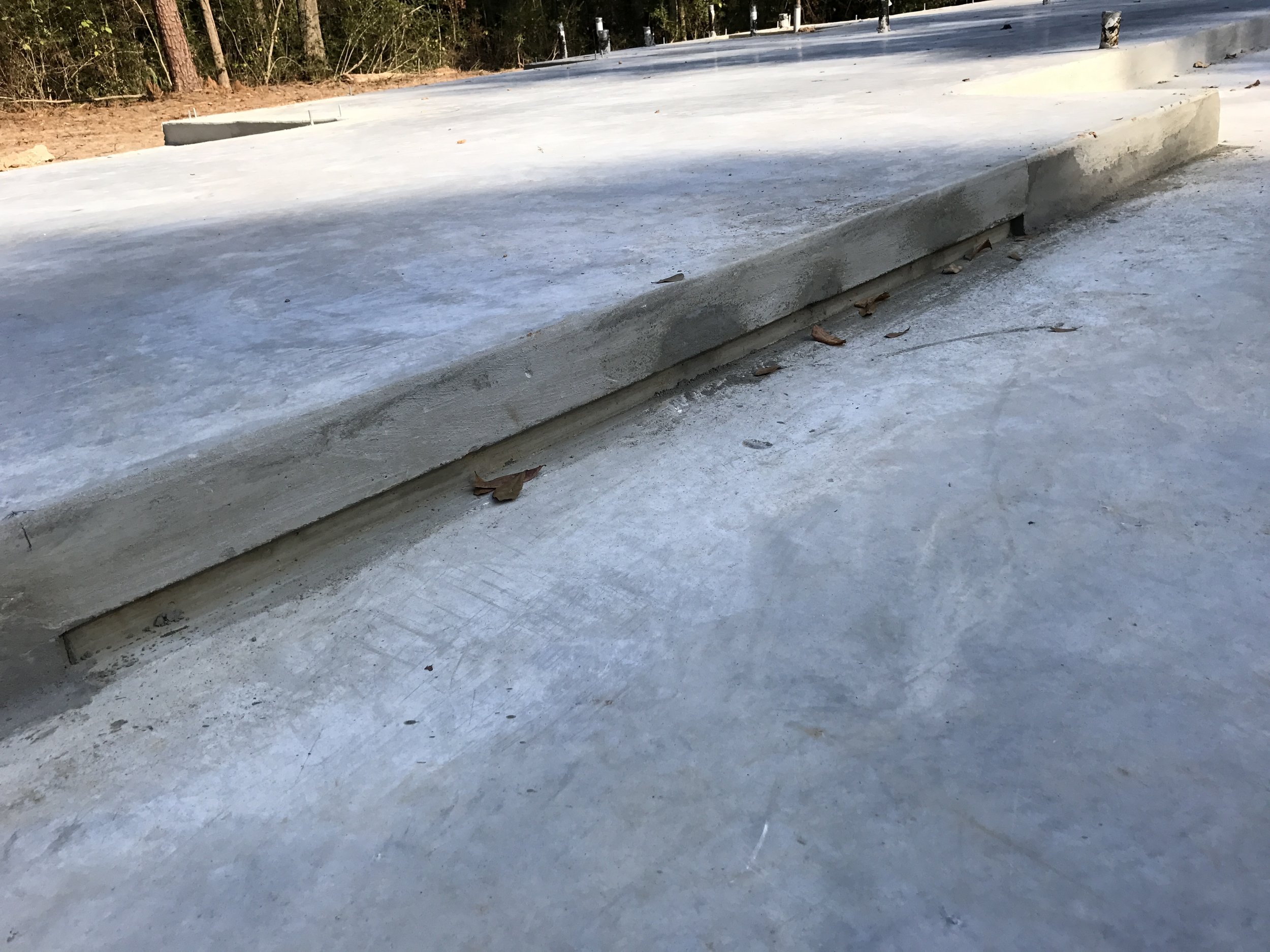 Proportionally, the reveal is approximately 1/3 the overall height of the step. The fairly shallow depth still allows for easy cleaning. Don't mind the leaves Mother Nature hasn't swept away just yet.