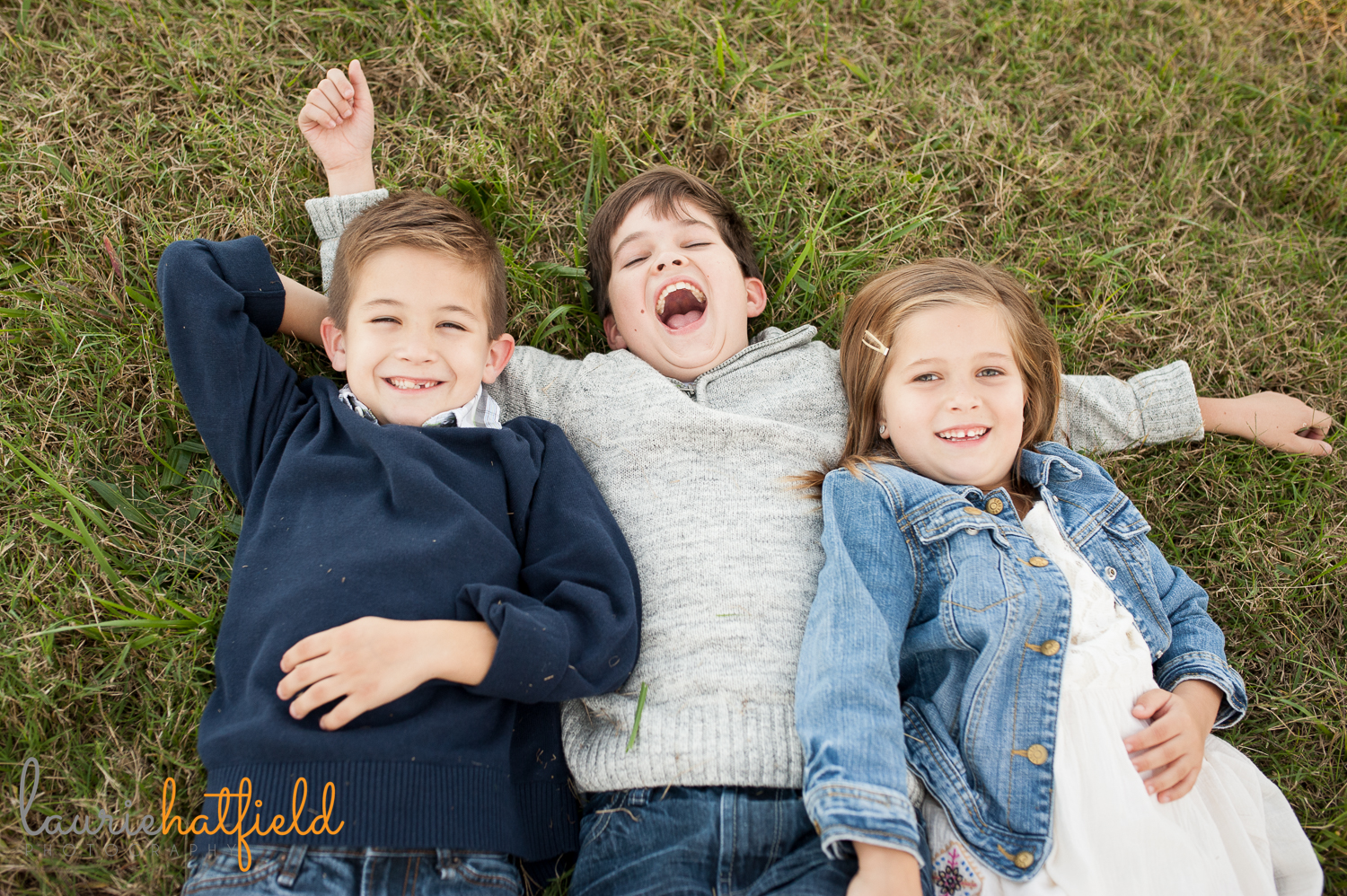 brothers and sister in grass